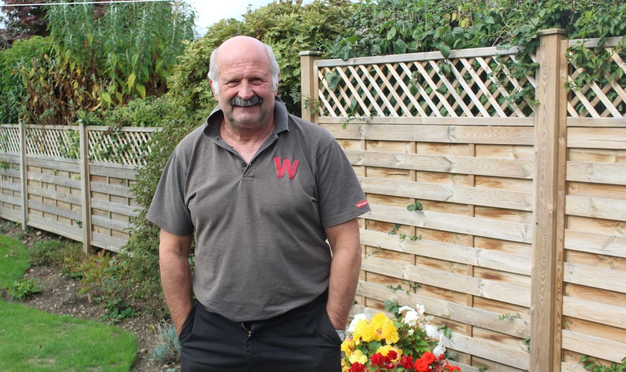 Ronnie standing in his garden and smiling at the camera