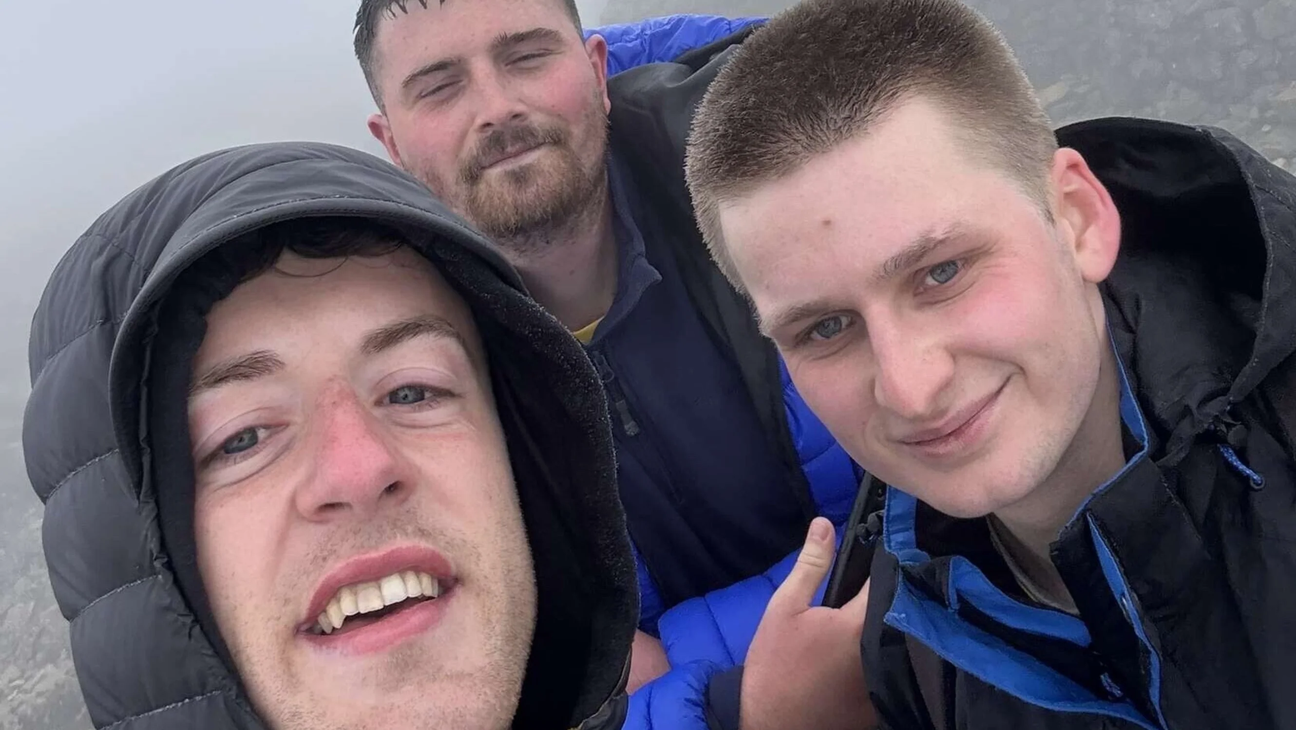 Lewis and two other people take a selfie at the top of Ben Nevis