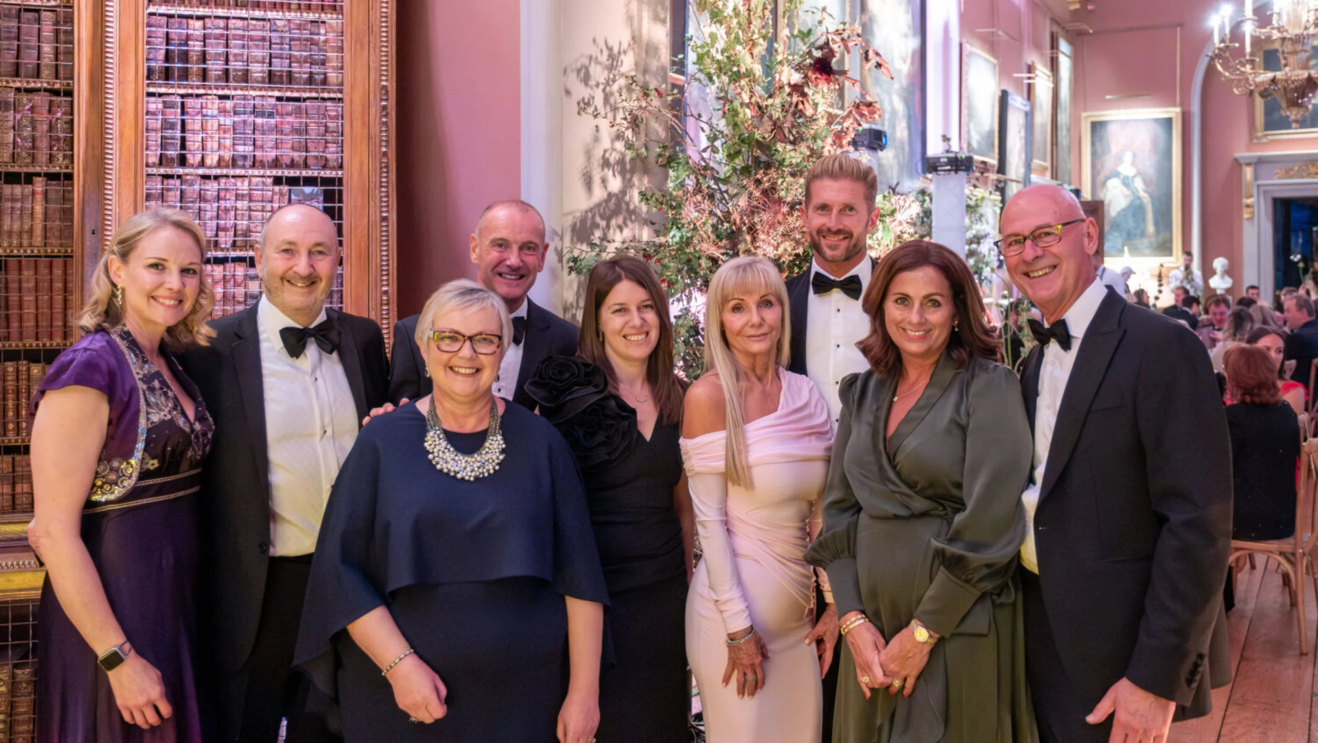 Group of guests gather to take a photo