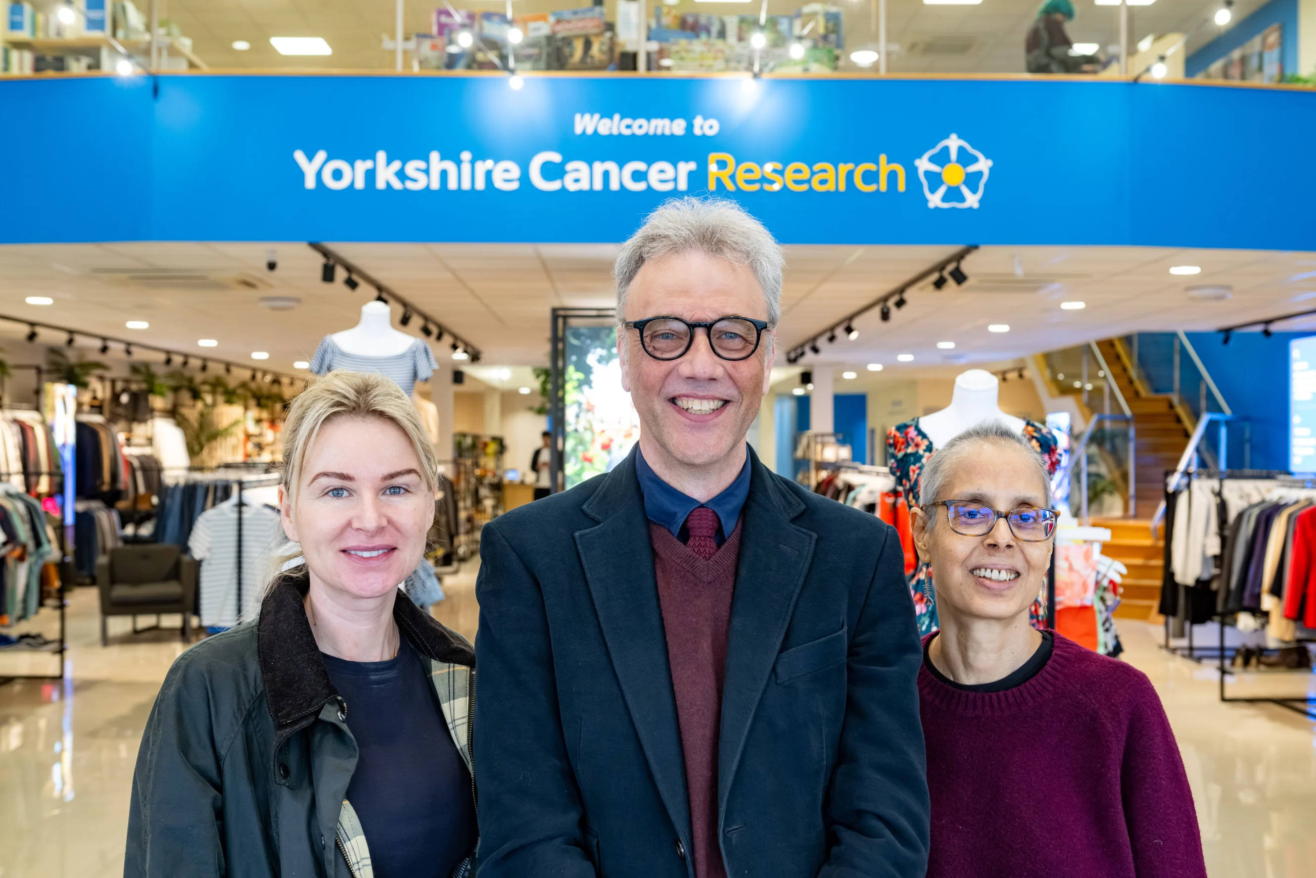 Three researchers based in York are standing in the entrance of the York superstore.