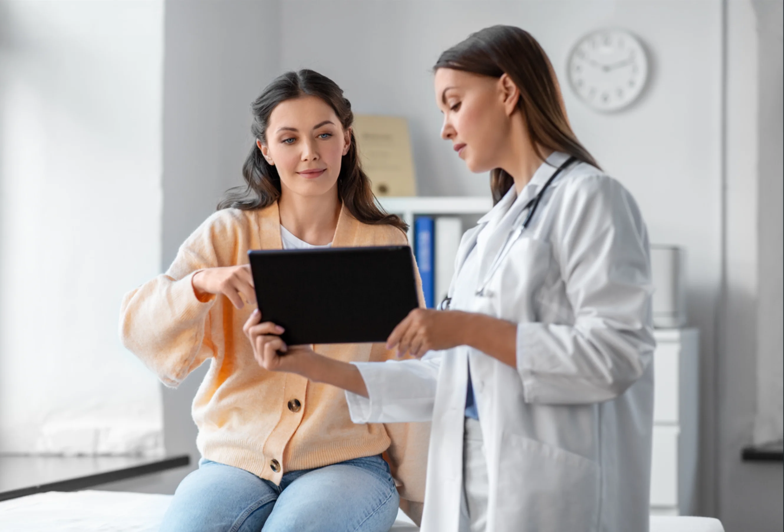 Female doctor speaking to a female patient