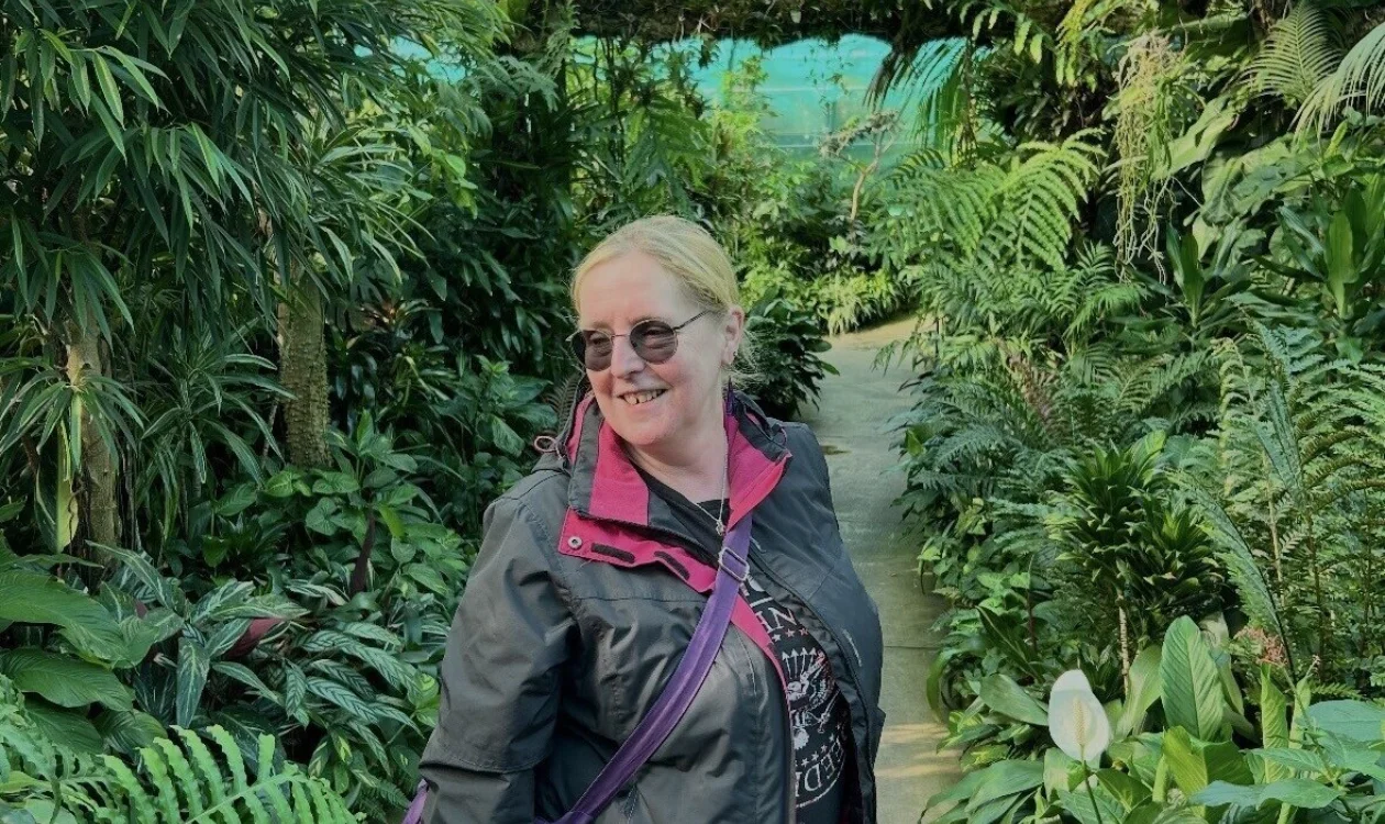 Chris is surrounded by greenery in Duthie Park in Aberdeen.