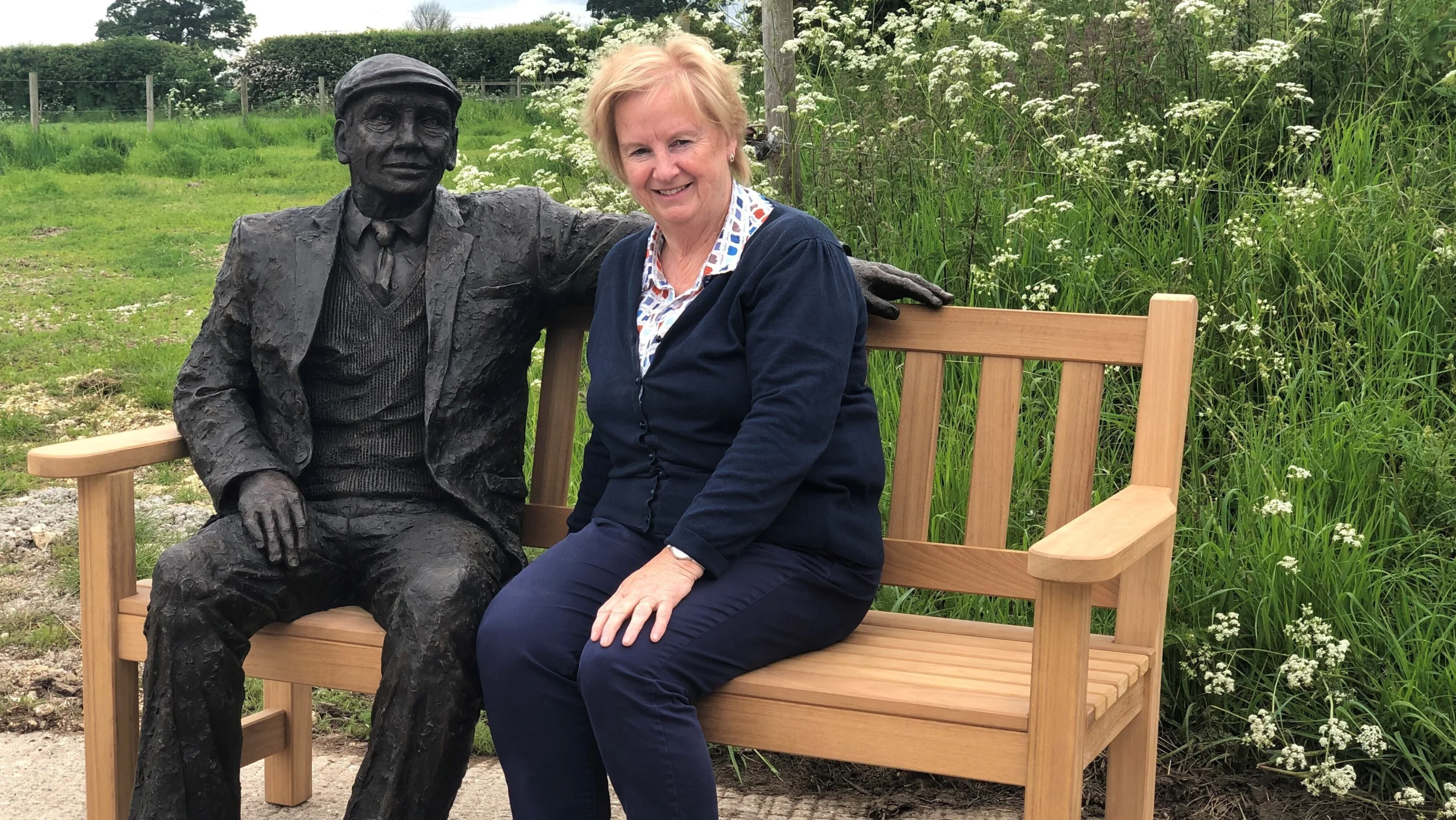 The late Jill Atley with her sculpture Arthur, on a bench together.