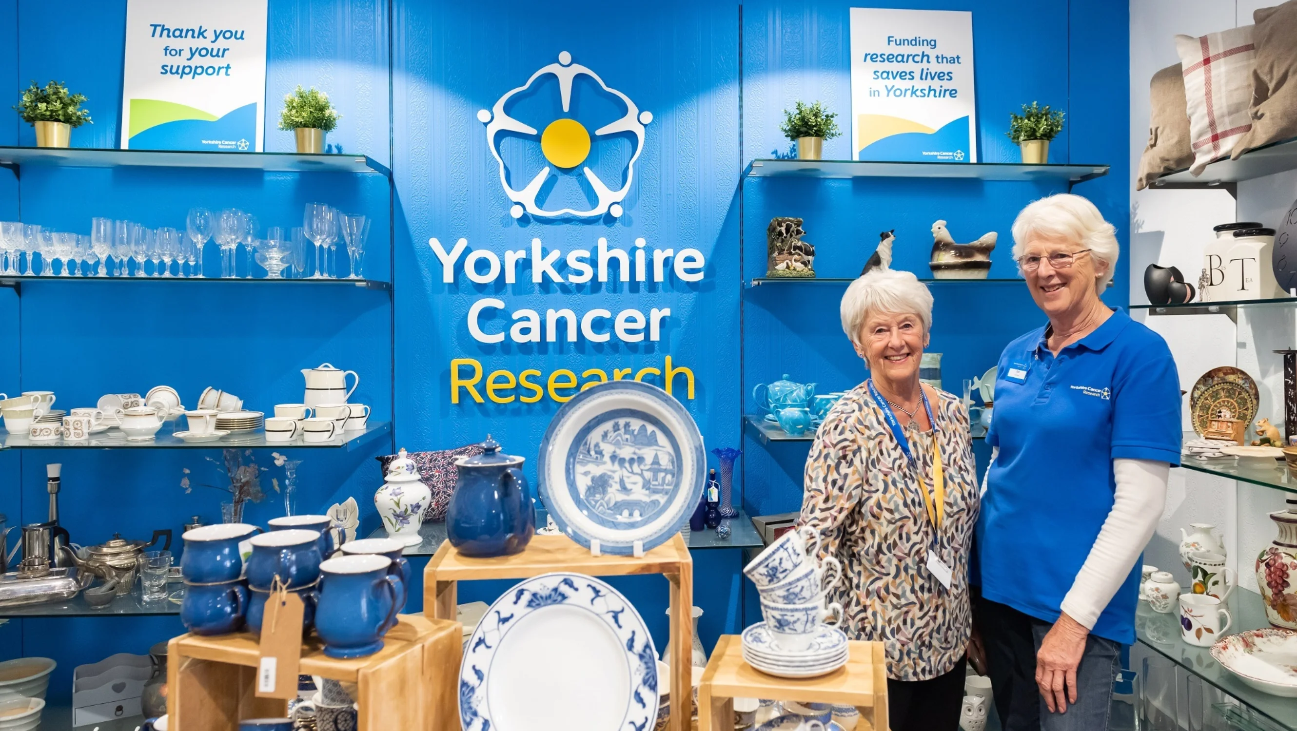 Two volunteers in Yorkshire Cancer Research shop in Harrogate