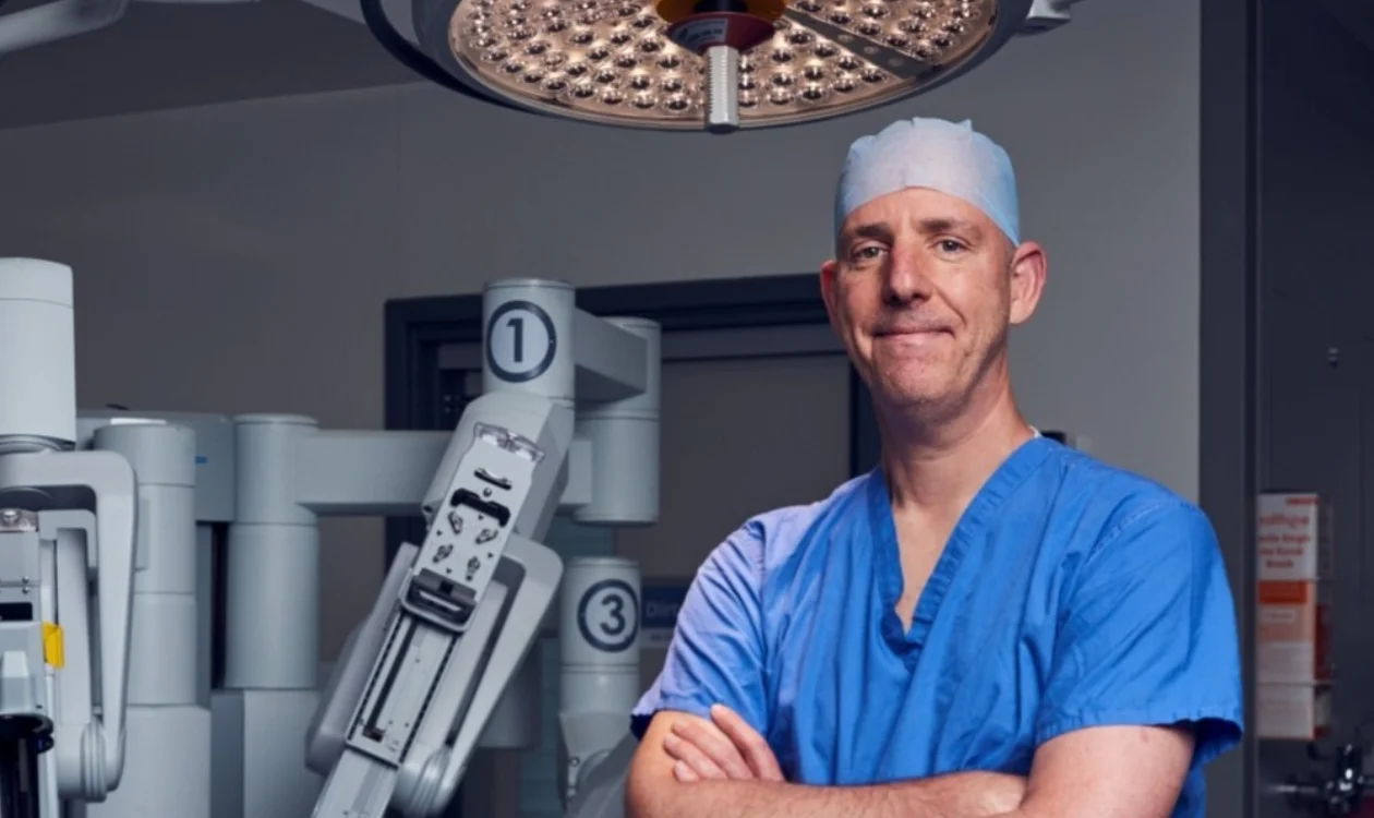 Professor Jim Catto in an operating theatre wearing scrubs