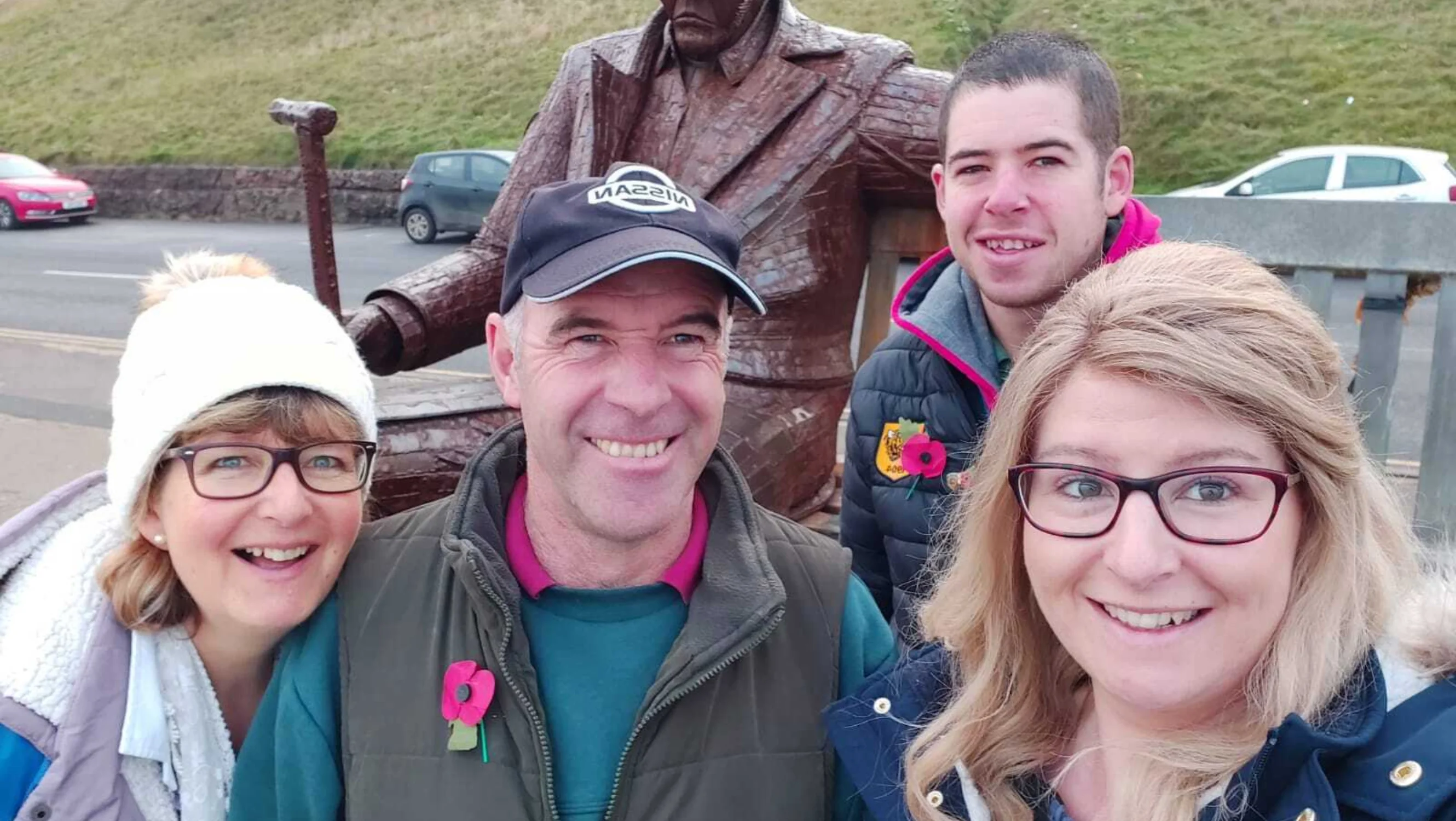 A selfie of Lesley, Philip, Richard, and Kristina with an outdoor sculpture.