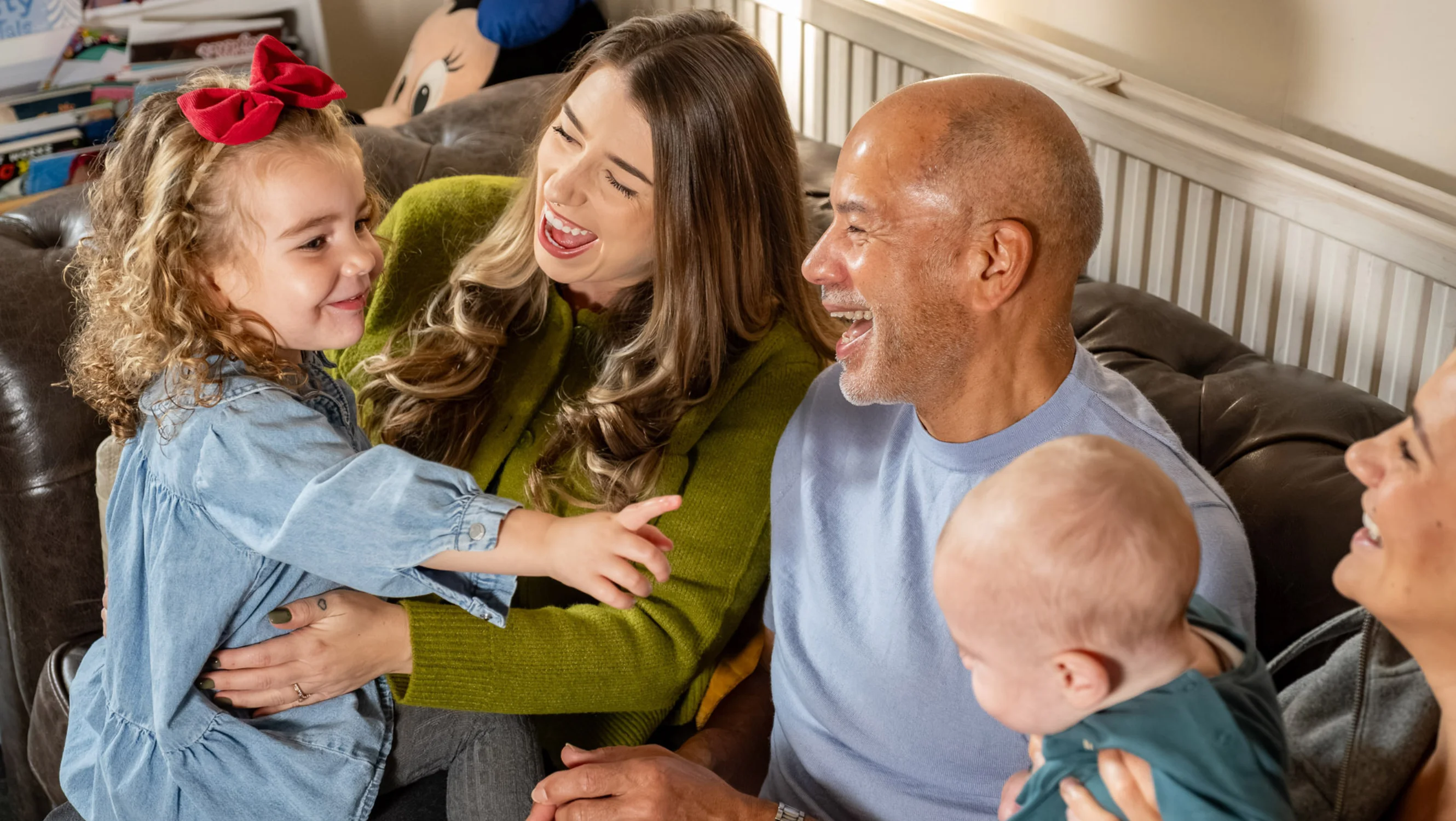 Rowen and Russell smiling at granddaughter Florence