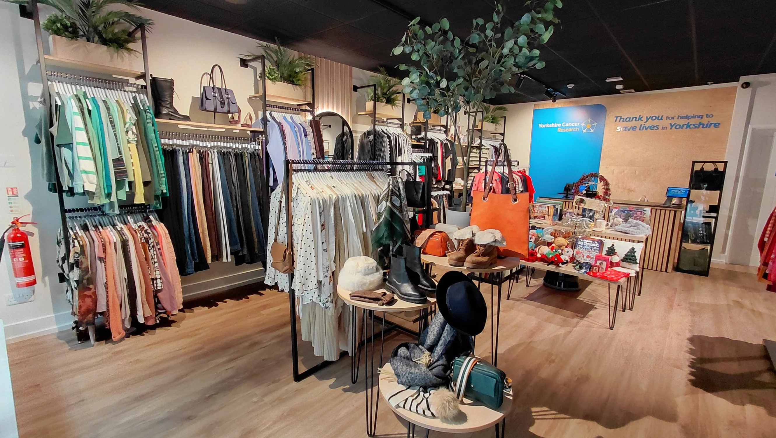 The interior of the Sheffield shop filled with an array of high-quality, pre-loved clothes and goods