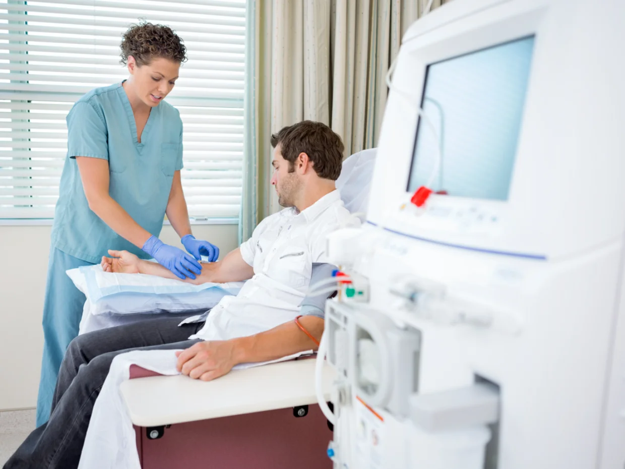 Female nurse treats male patient