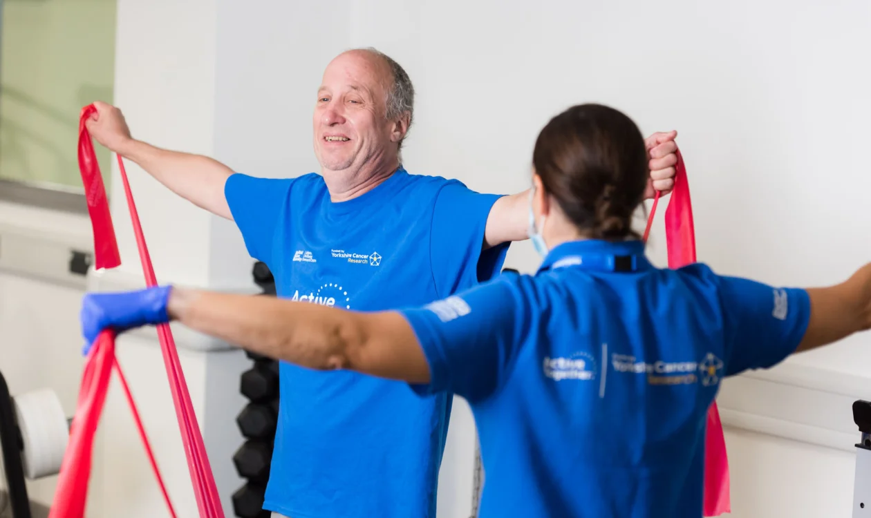 Patient doing strength exercises with support from a member of the Active Together team