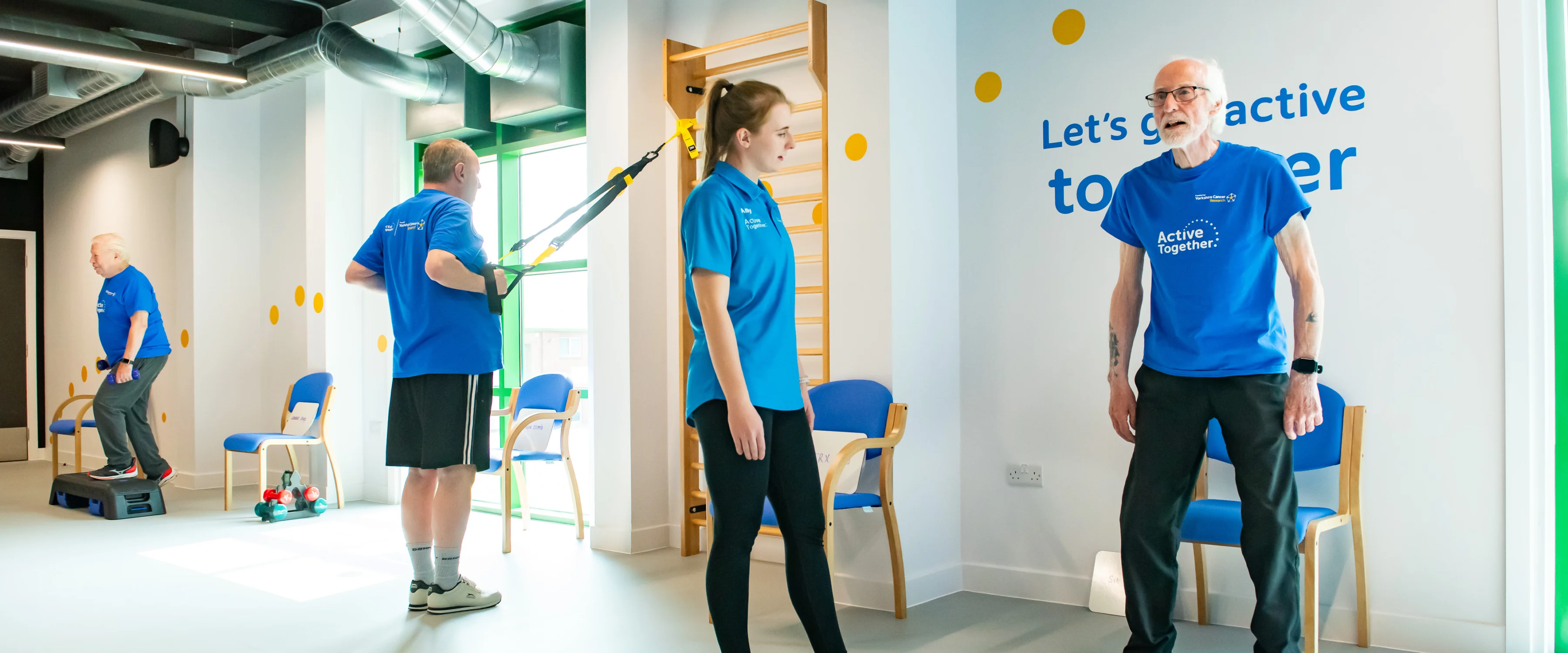 People in a group class exercising in a gym studio