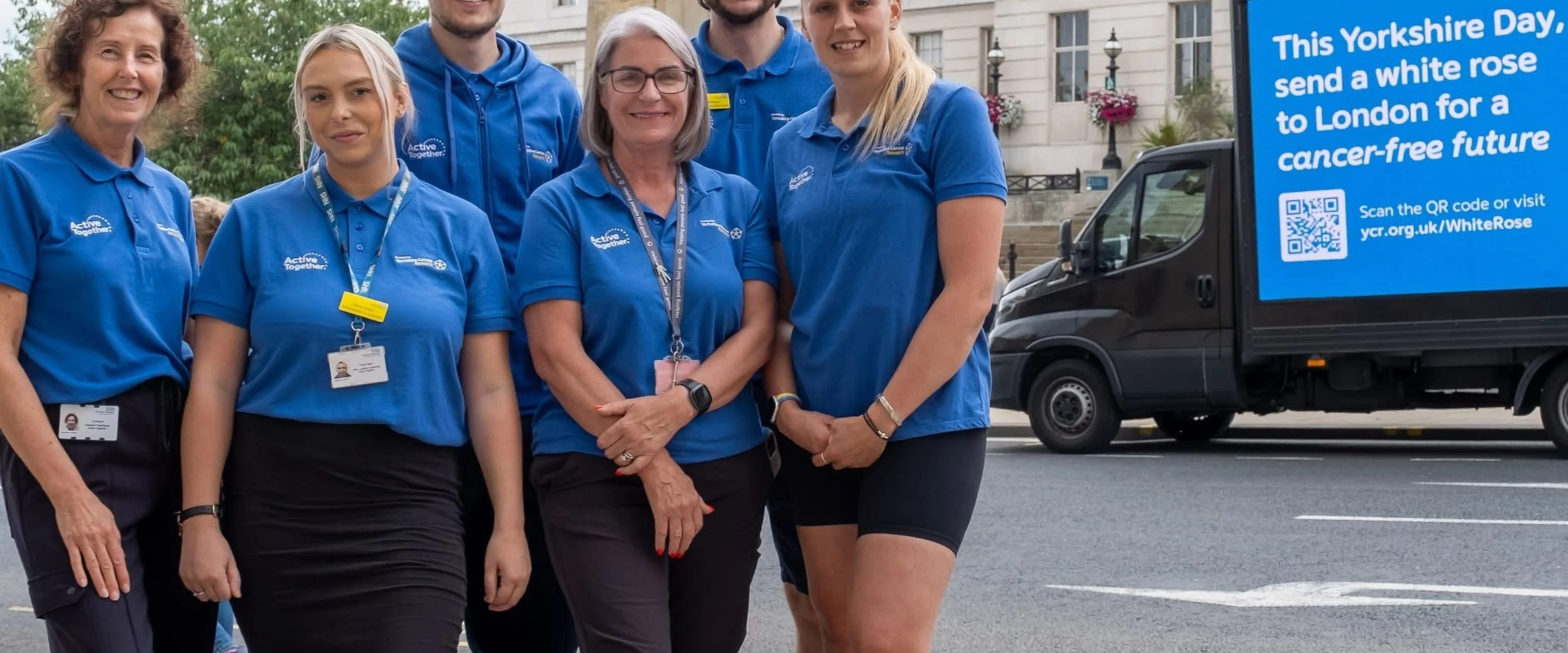 A group of people dressed in blue uniform outside