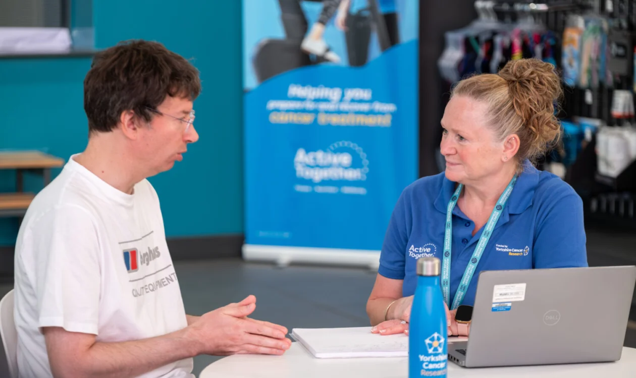 Two people sat down talking