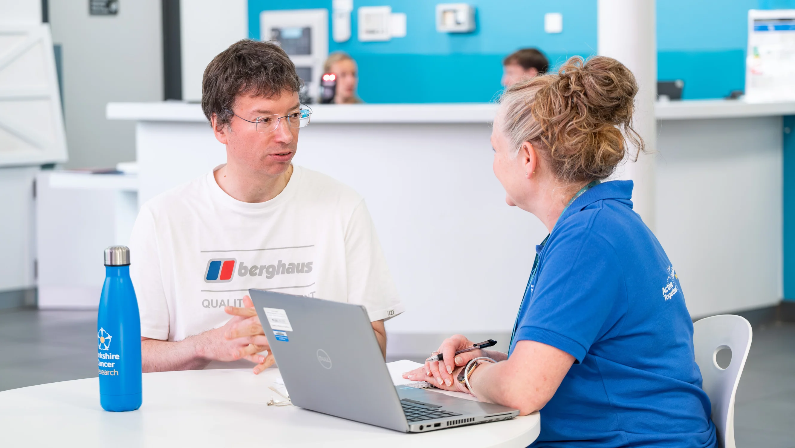 Two people talking sat down