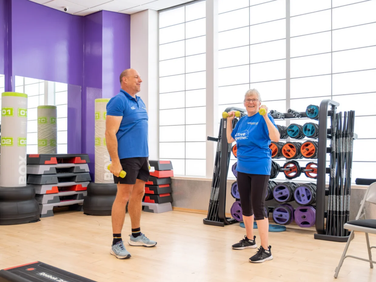 Two people exercising in a gym studio
