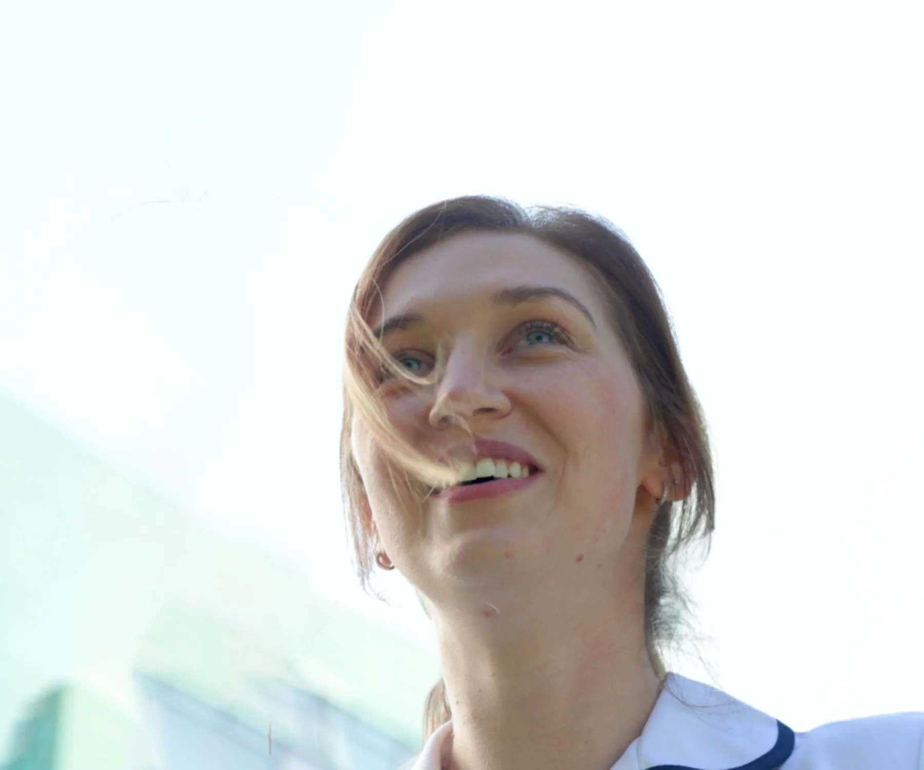 nurse smiling outside hospital