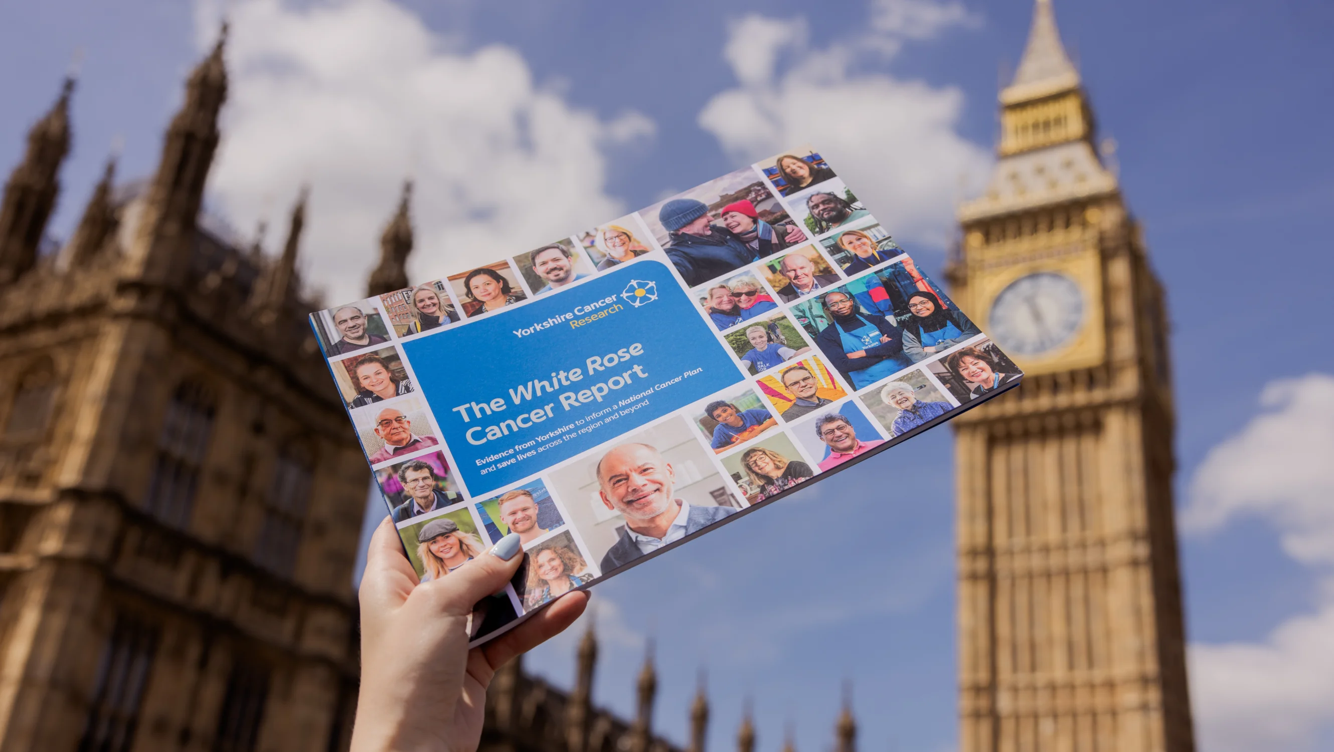 The White Rose Cancer Report, held aloft in front of the Houses of Parliament