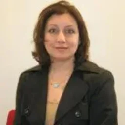 A lady with a brown bob smiling