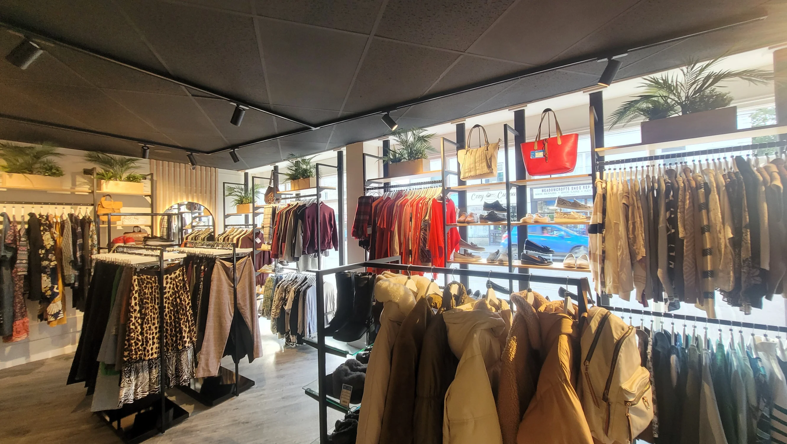 Rails of fashionable clothing inside the Skipton Keighley Road shop