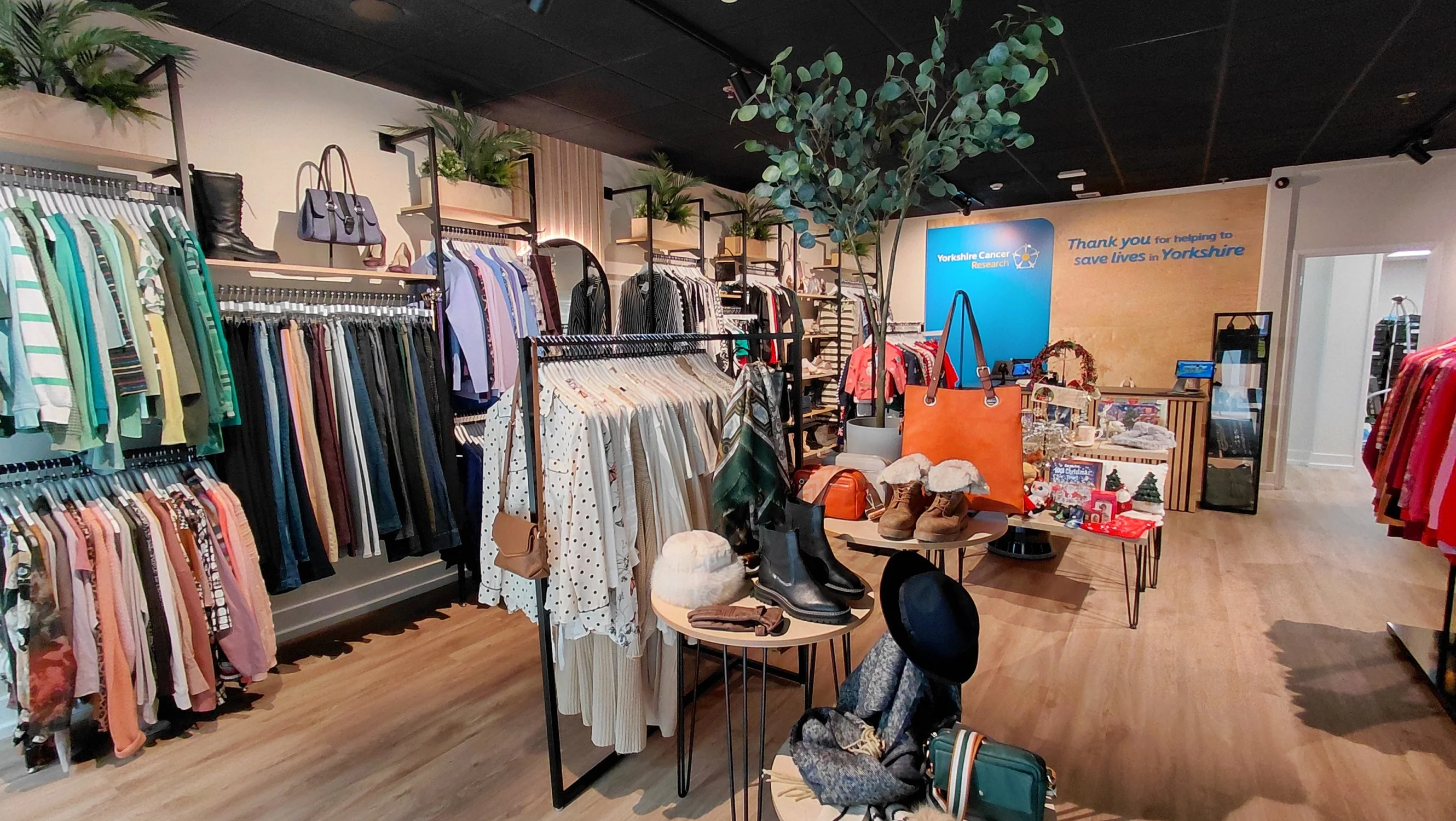 Displays of clothes and accessories inside a modern and well organised shop