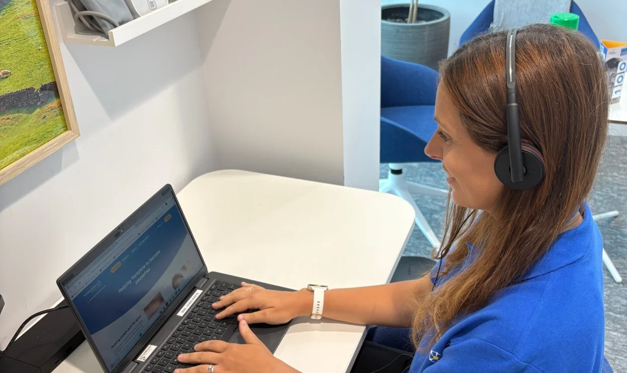 Woman at a desk with headset on