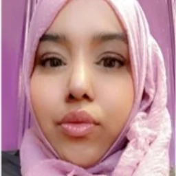 a lady in a pink head scarf