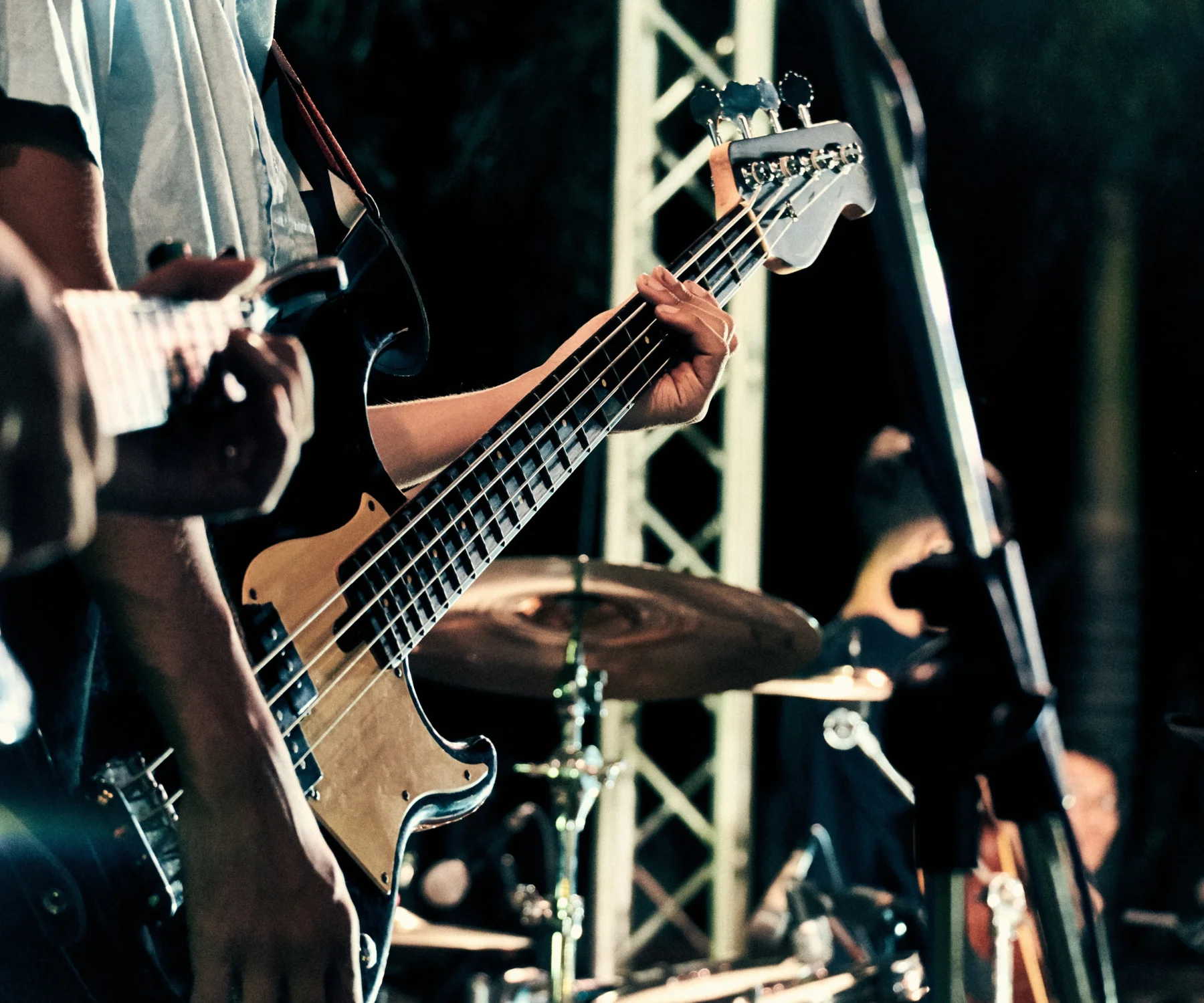 Generic image of a man playing a guitar on stage.