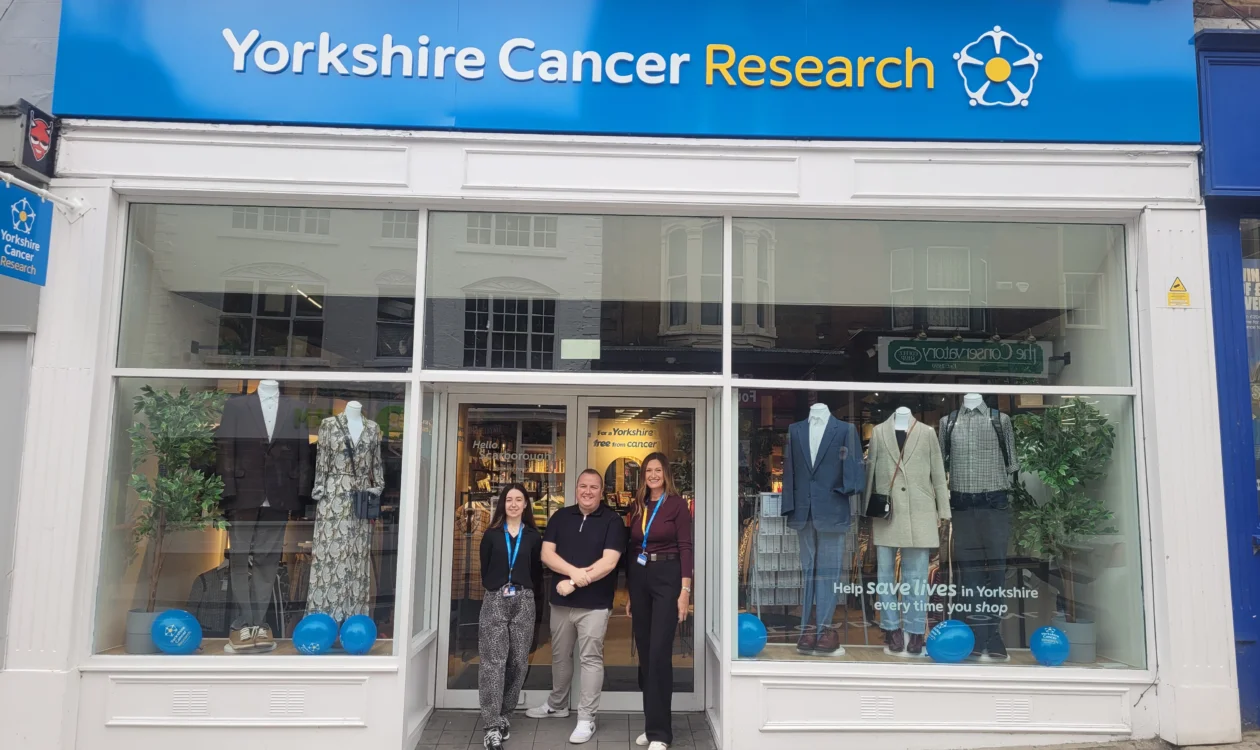 Employees in front of the Yorkshire Cancer Research Scarborough shop