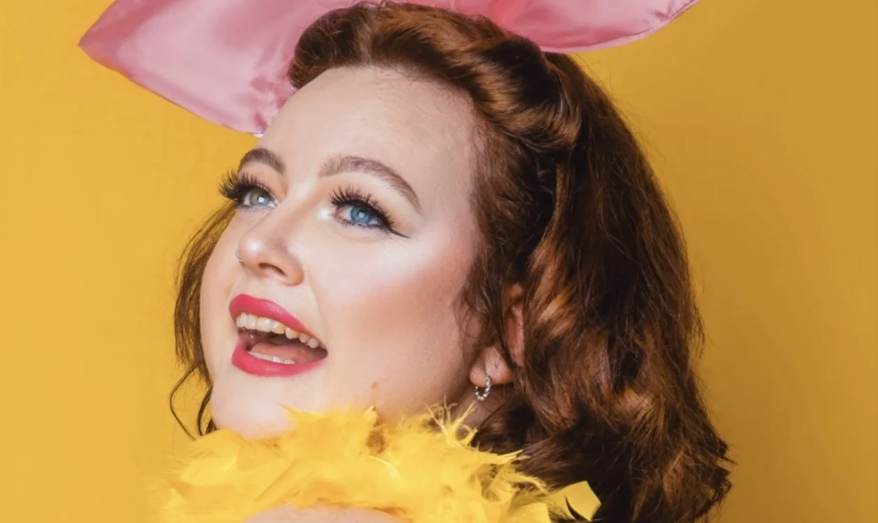 A headshot of Jade in her burlesque attire