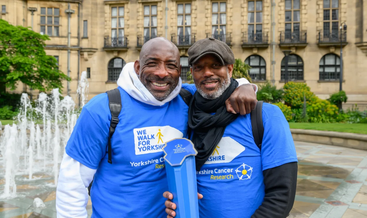 Johnny Nelson hugging his friend Aaron Casserly Stewart