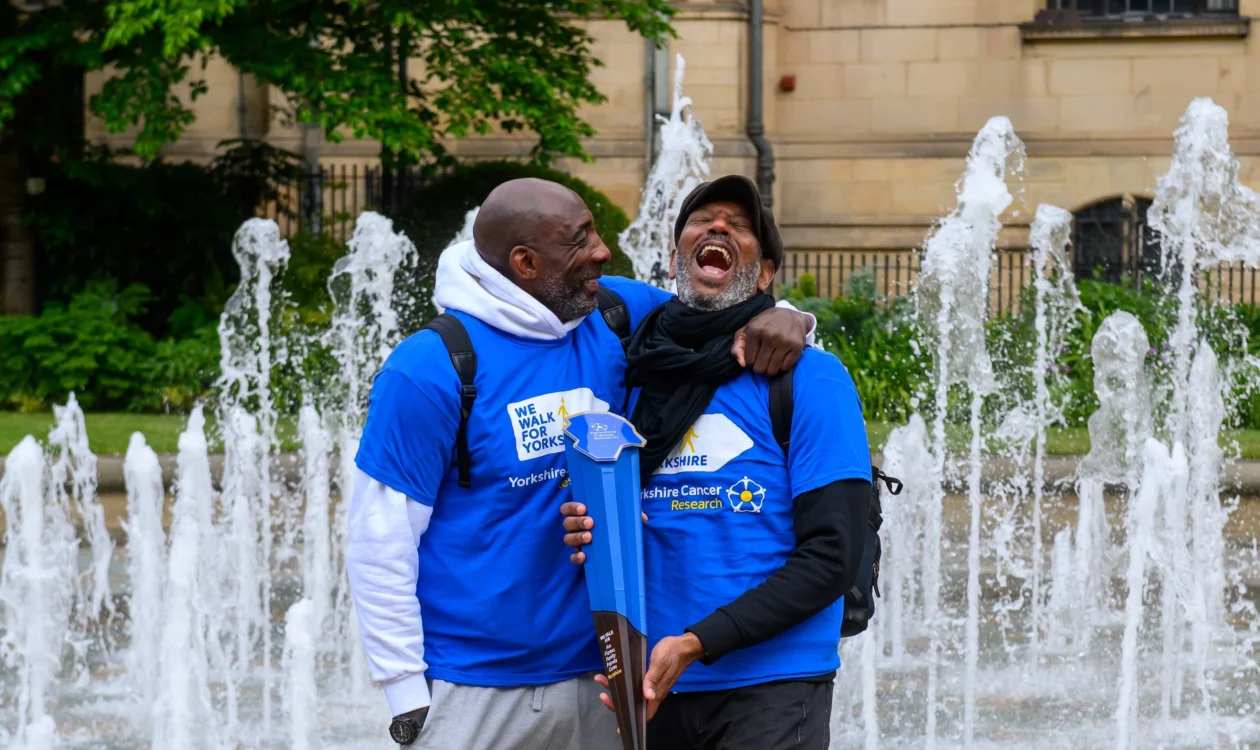 Johnny and Nelson laughing and smiling