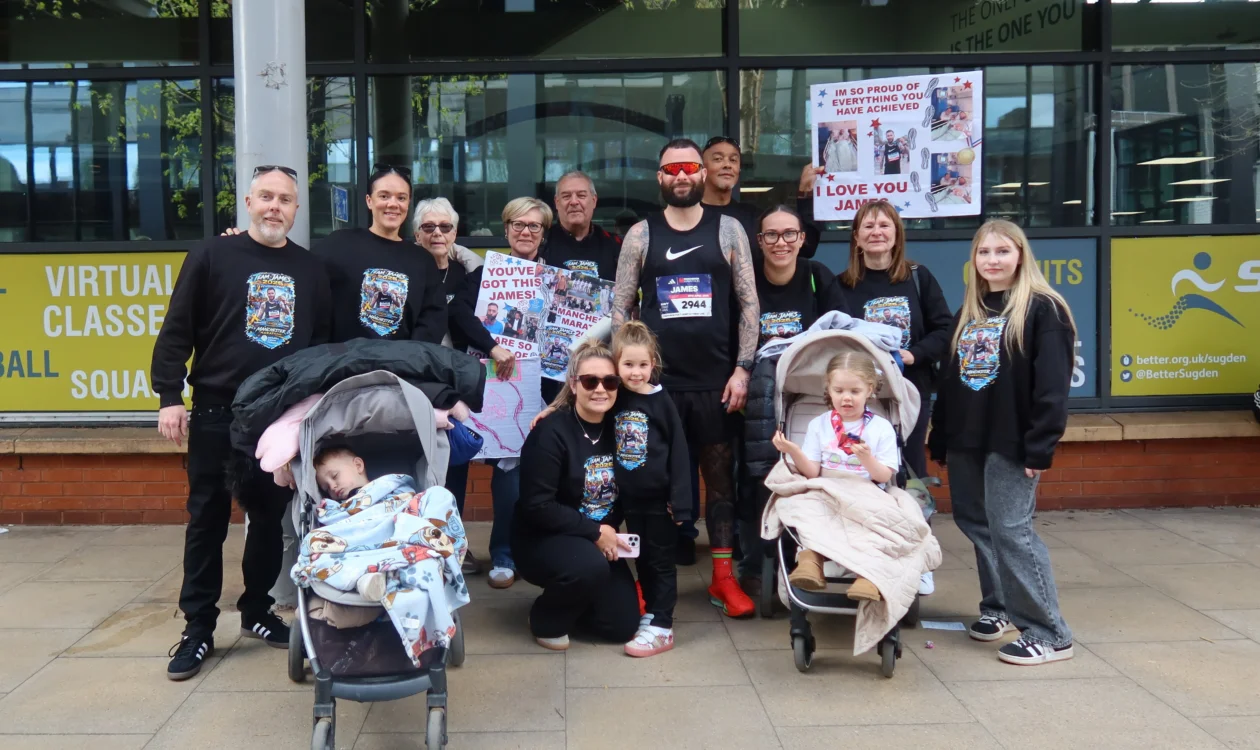 James with his family after completing the Manchester Marathon