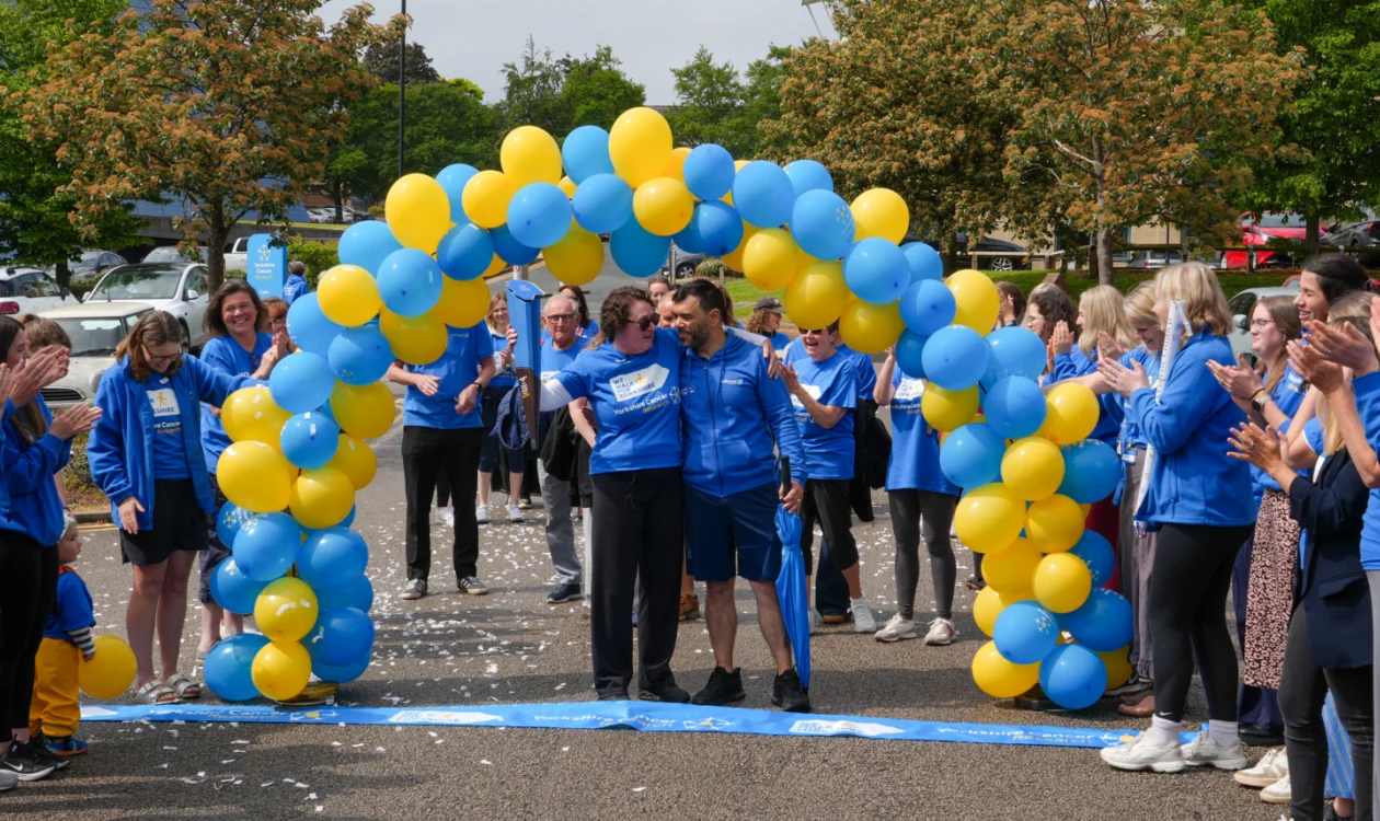 Katie and Andy crossing the finish line