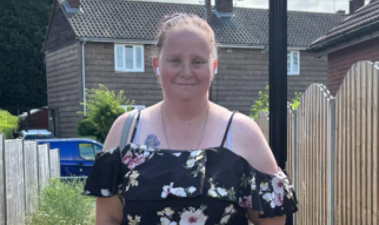 Becky standing in her back garden