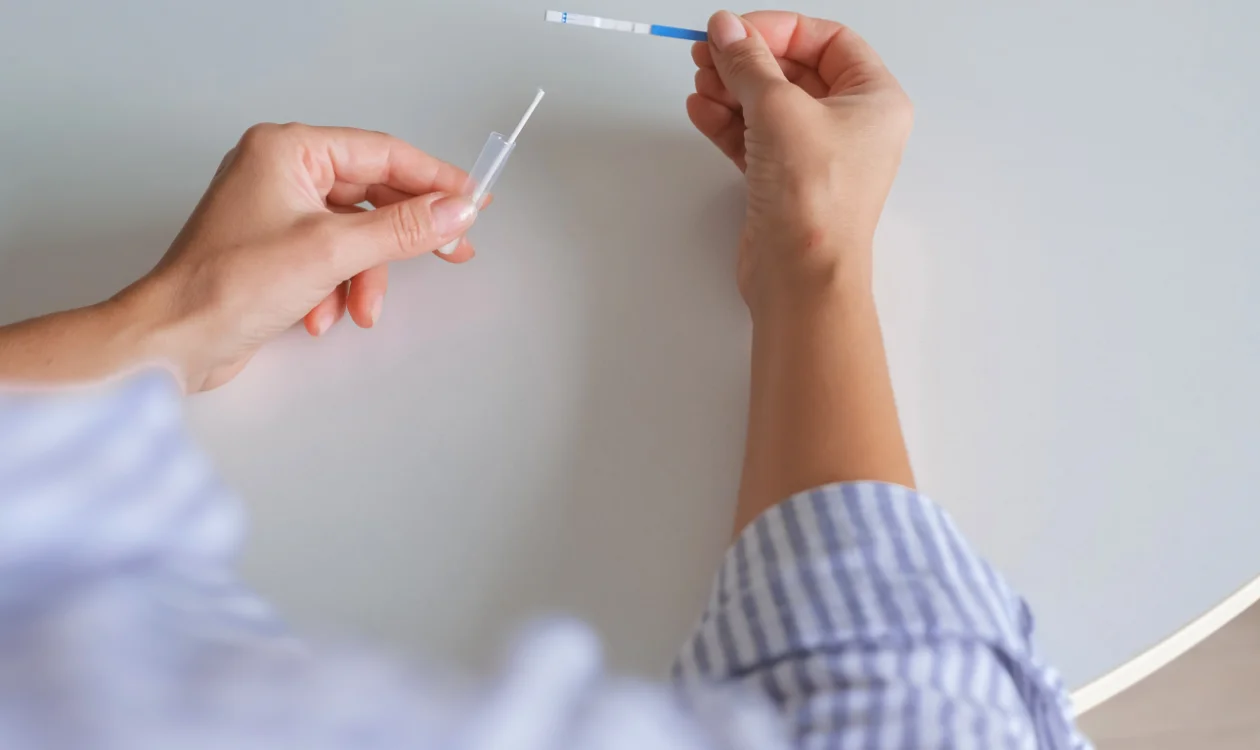 Two hands taking a swab test