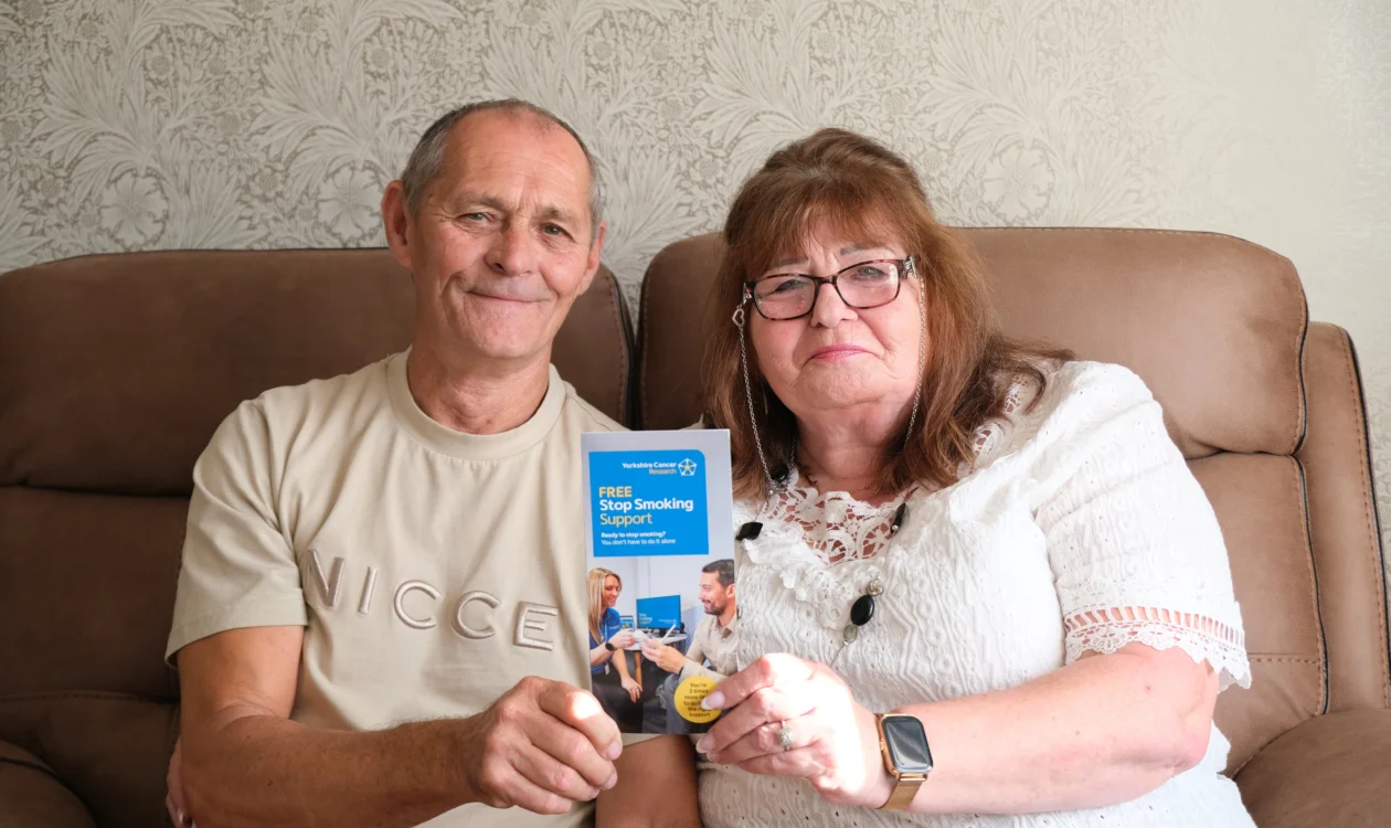 Linda and Terry holding a stop smoking support leaflet