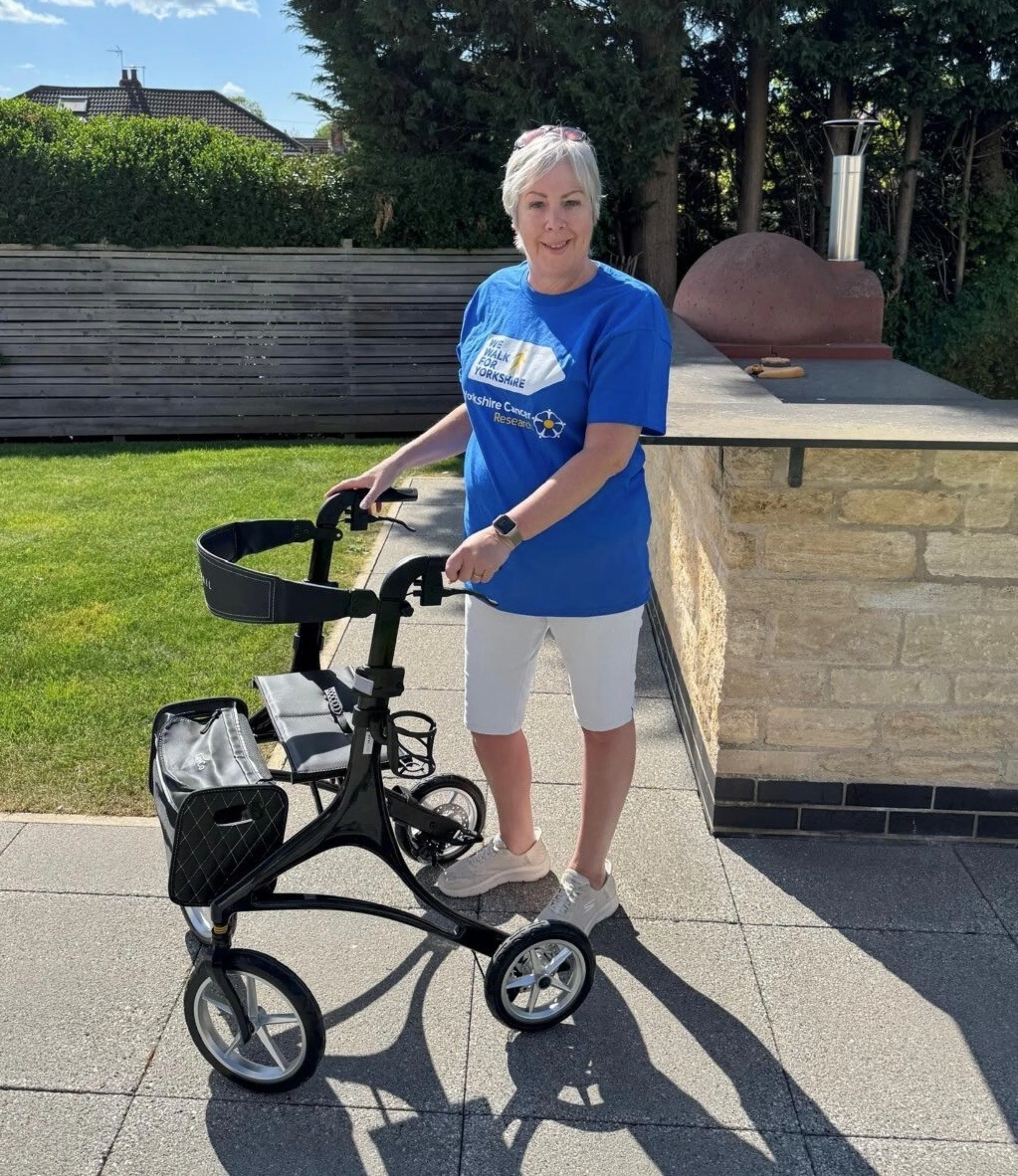 Louise with her walker in the garden