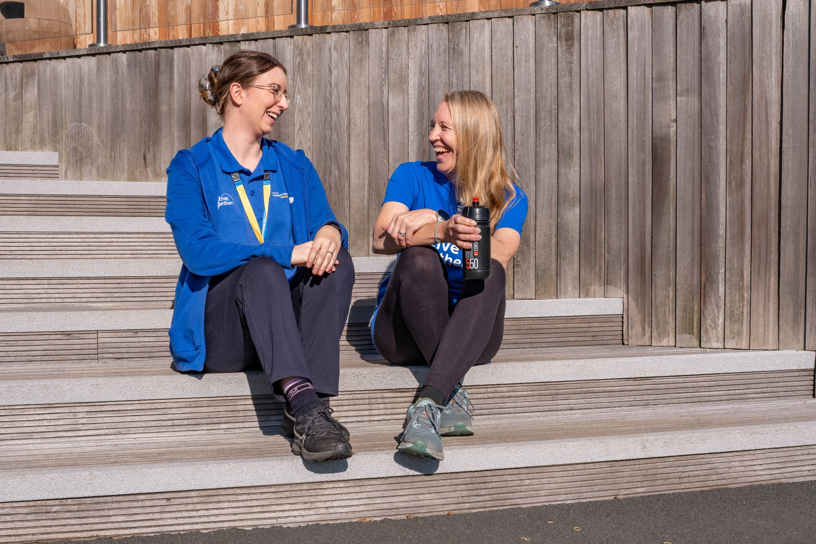 Ellie, left, and Leona, right, enjoy a chat outside Ilkley Lawn Tennis & Squash Club