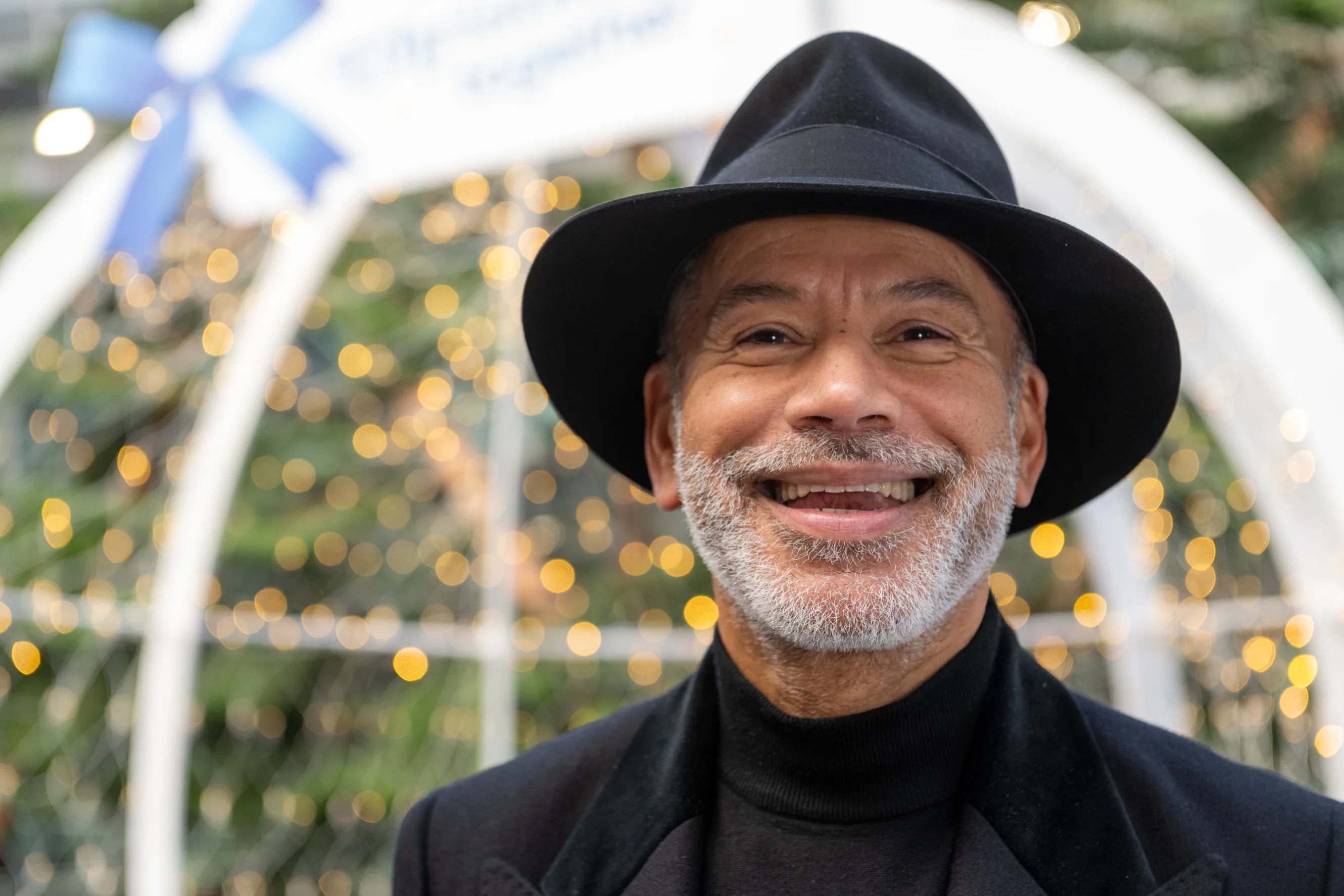 Russell McFarlane smiling in front of the snow globe