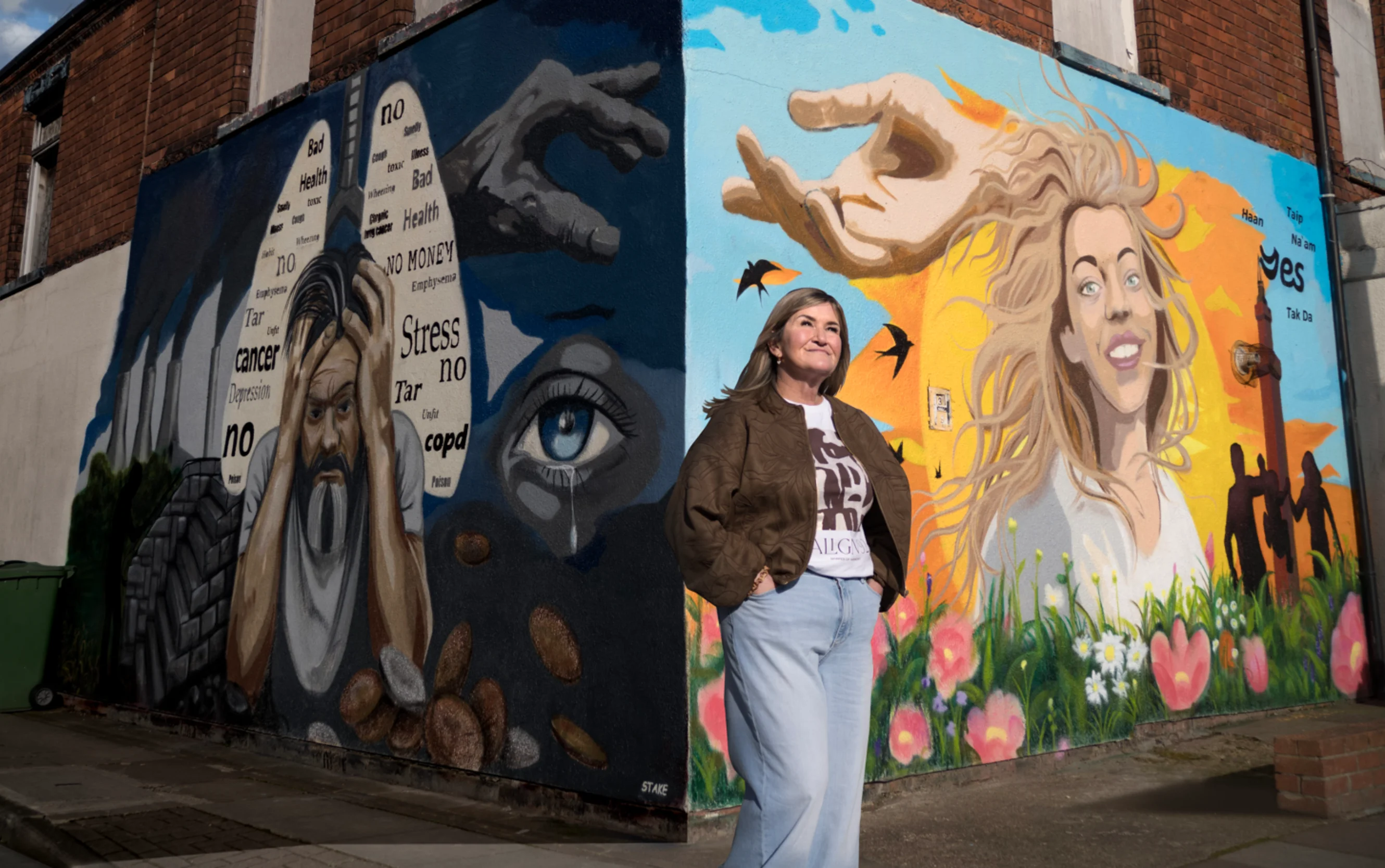 Wendy standing in front of the 'Turn the Corner' campaign wall