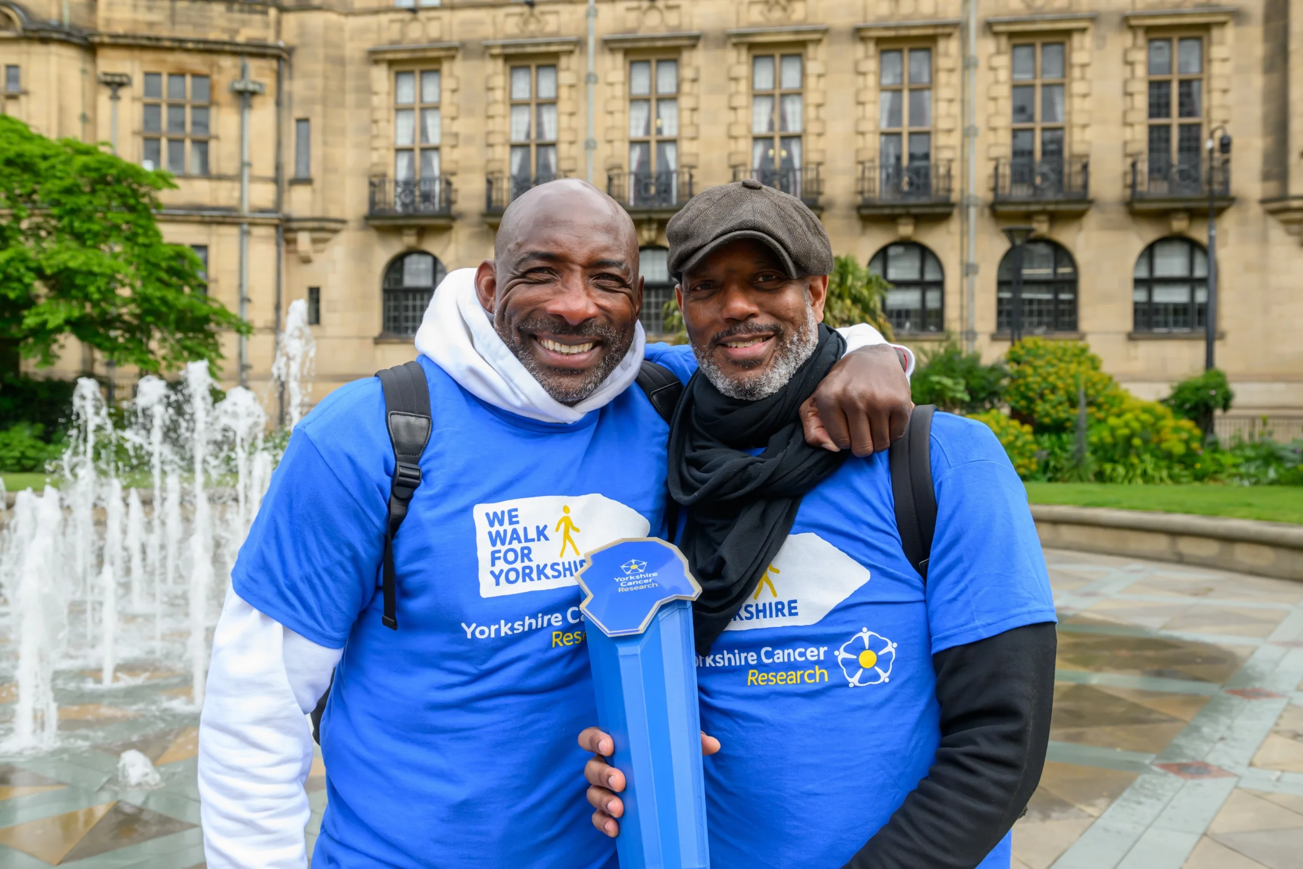 Johnny Nelson hugging his friend Aaron Casserly Stewart