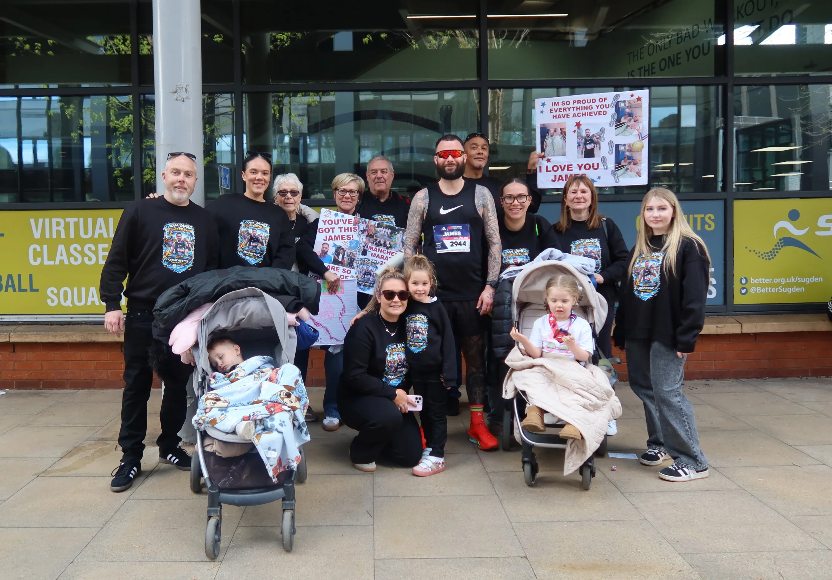James with his family after completing the Manchester Marathon