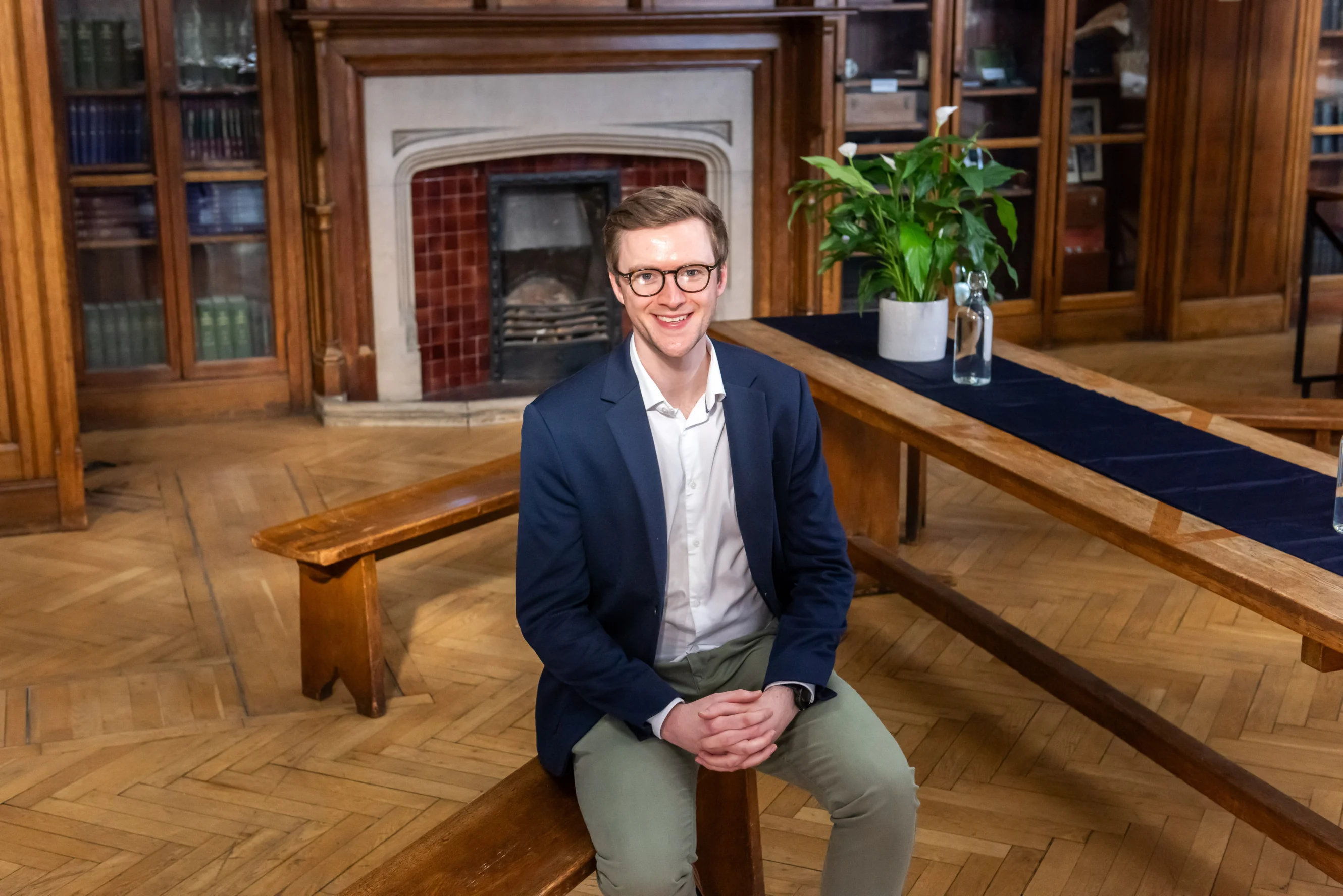 Dr James Platt sitting on a bench