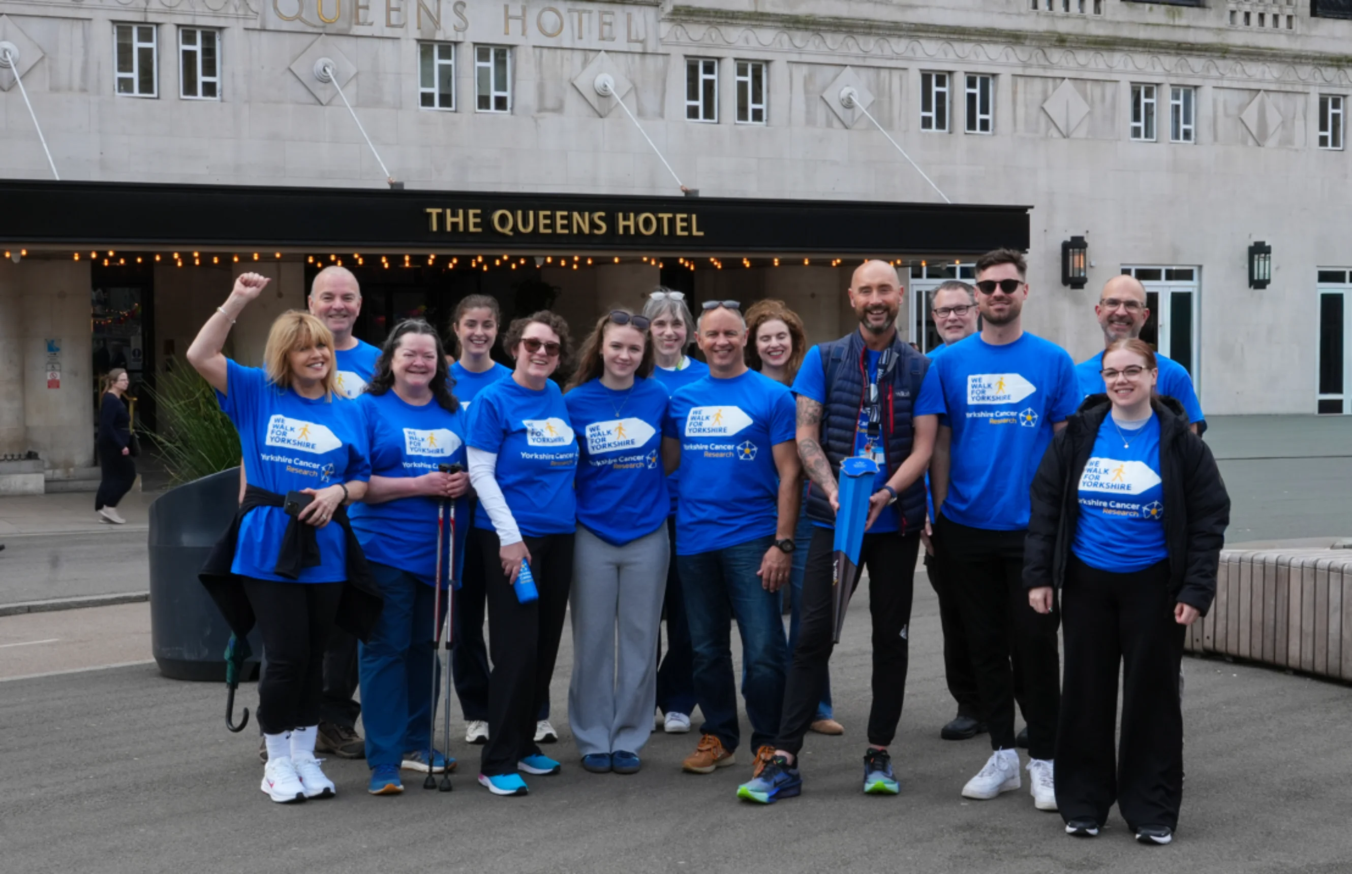 Group photo with everyone in front of the Queens Hotel