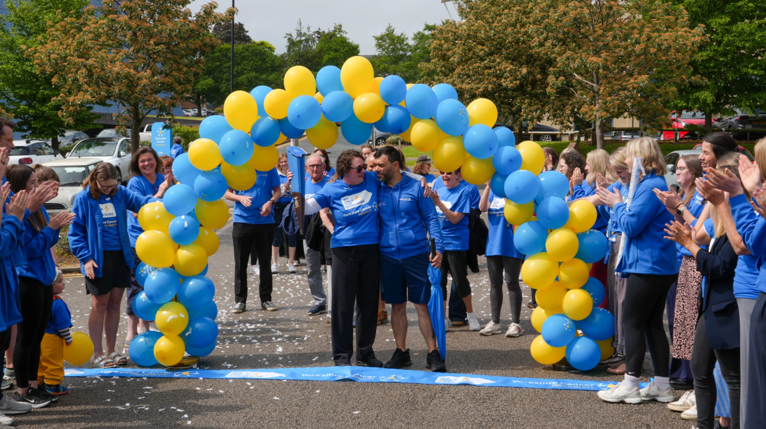 Katie and Andy crossing the finish line