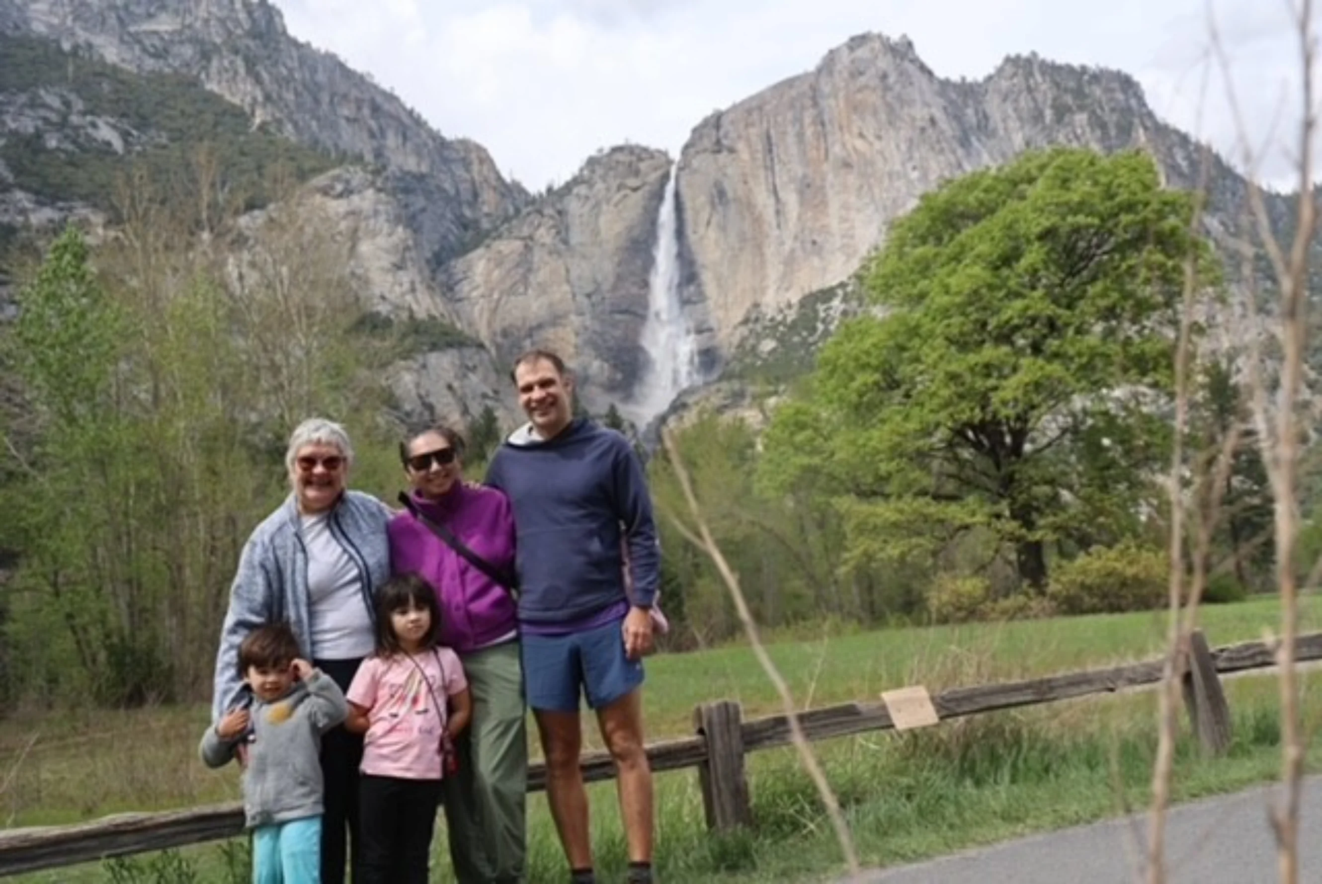 Family on a hiking trial surrounded by mountains