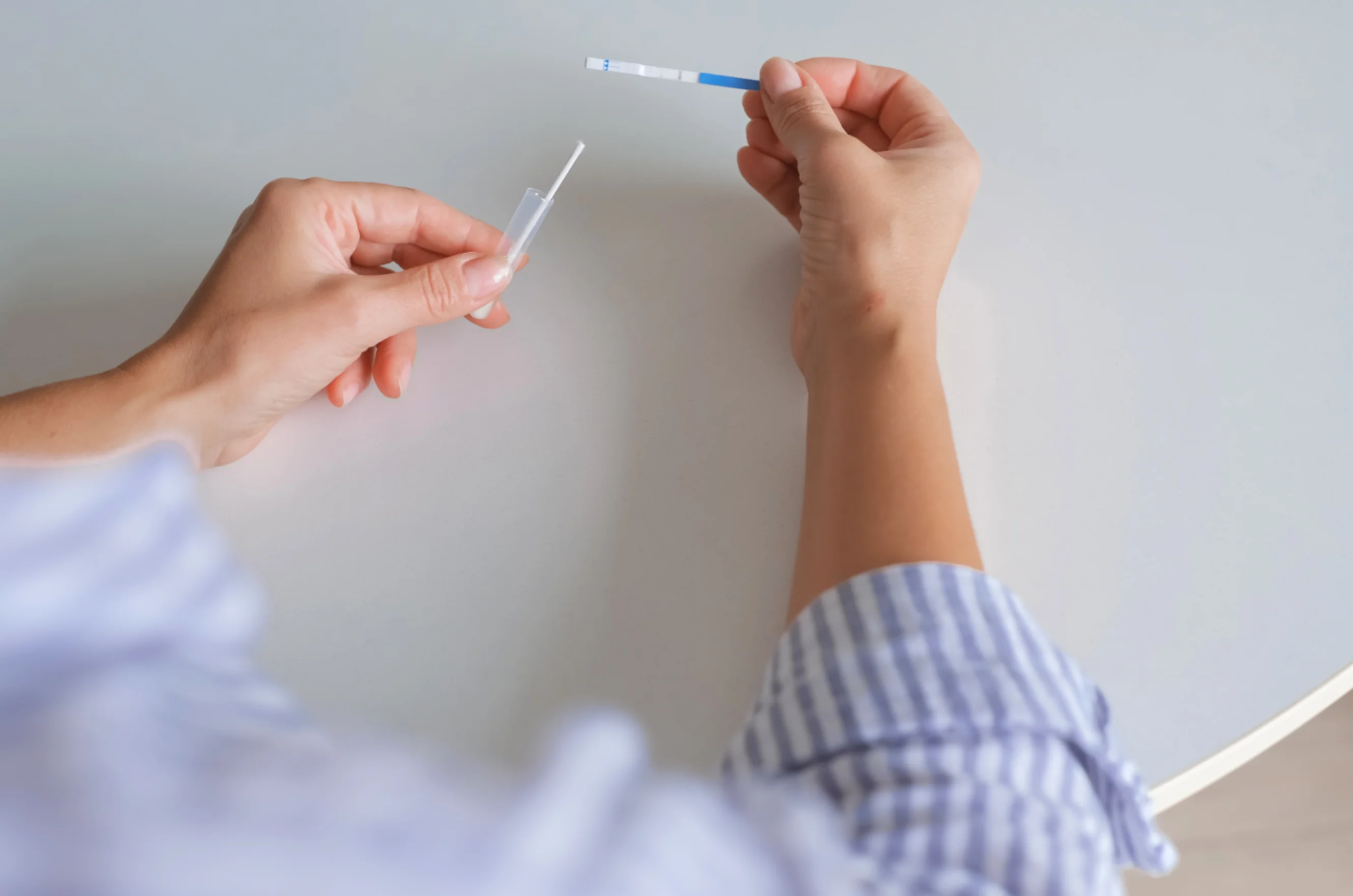 Two hands taking a swab test