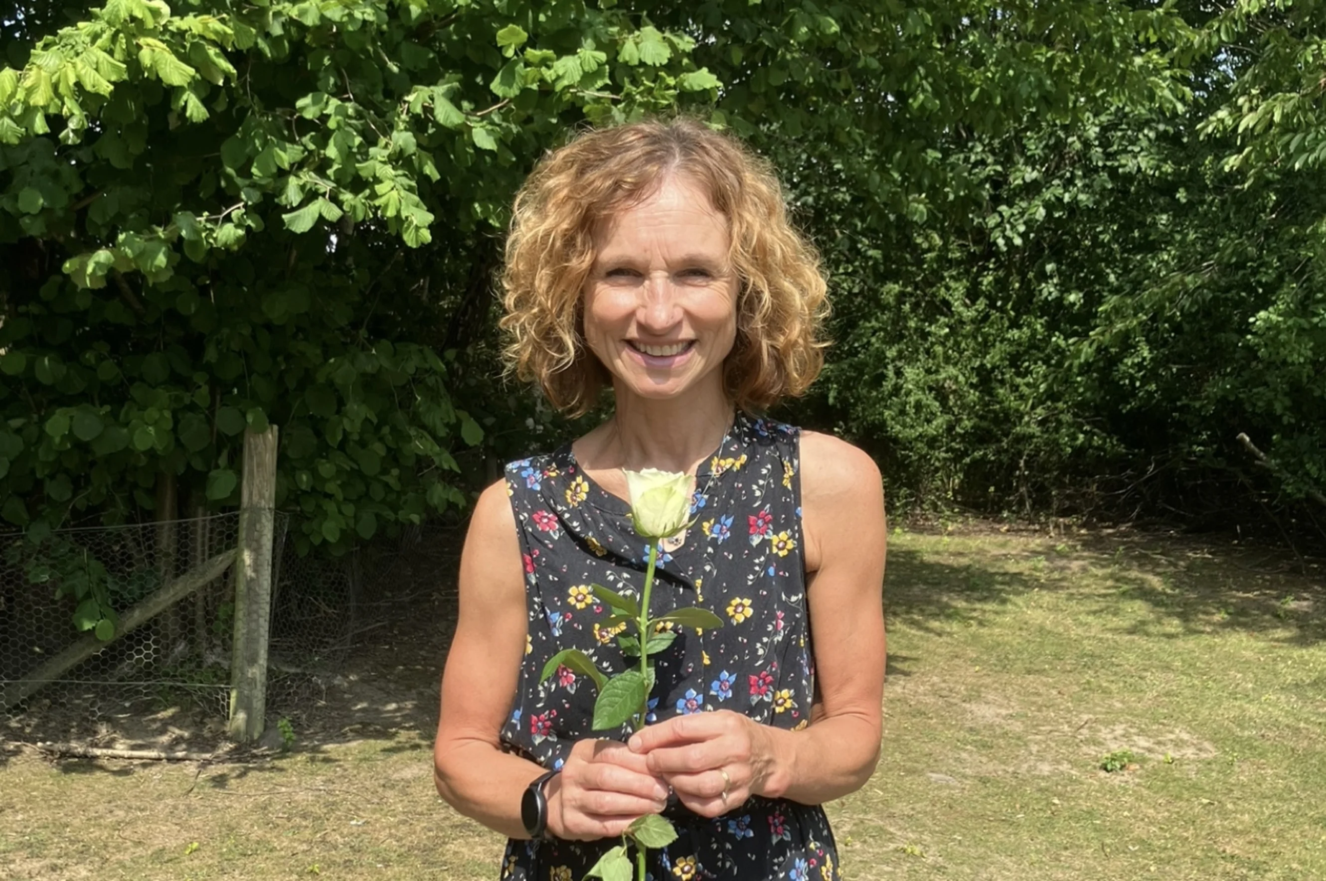 Jackie holding a white rose