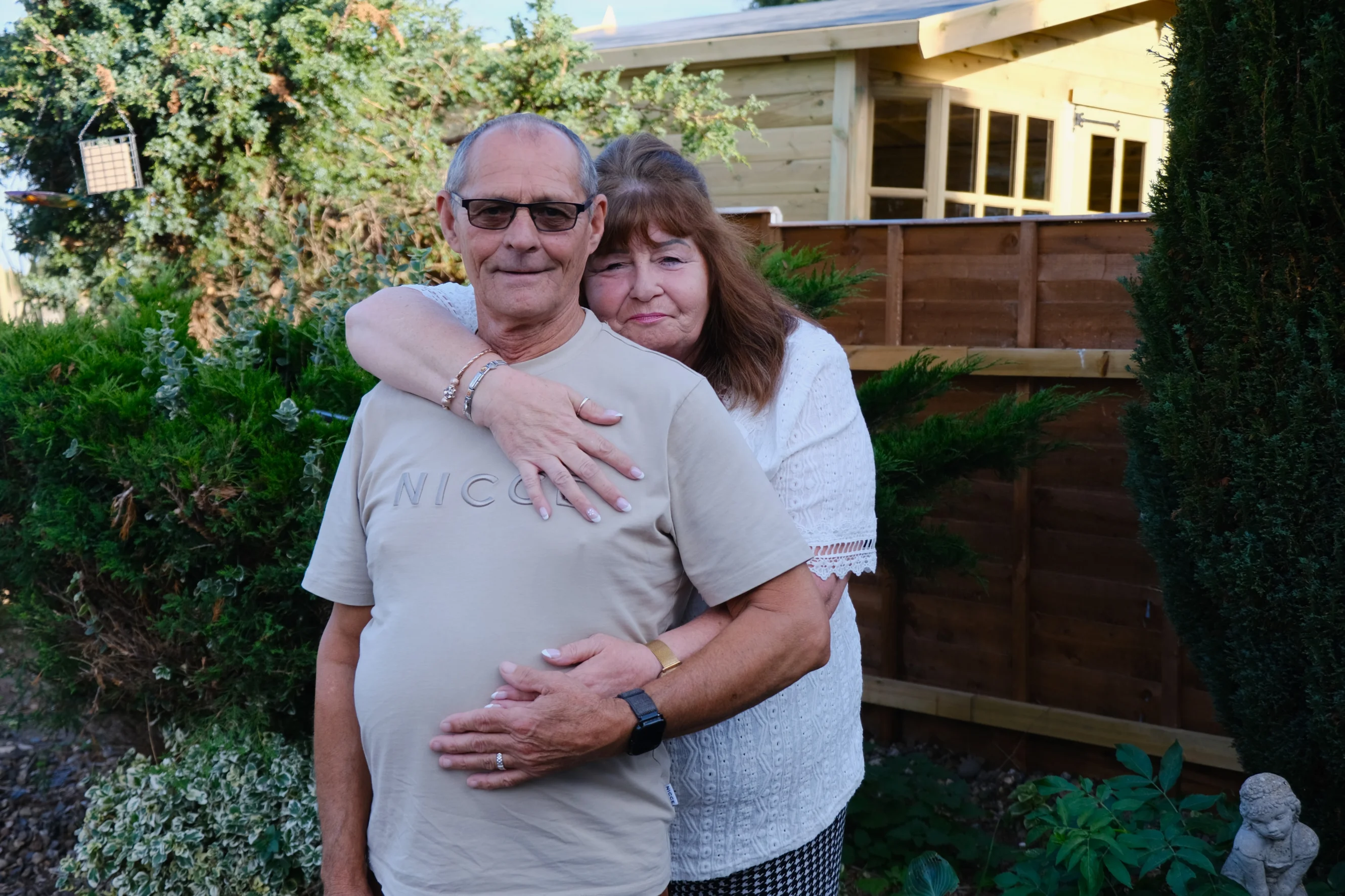 Linda and Terry hugging each other