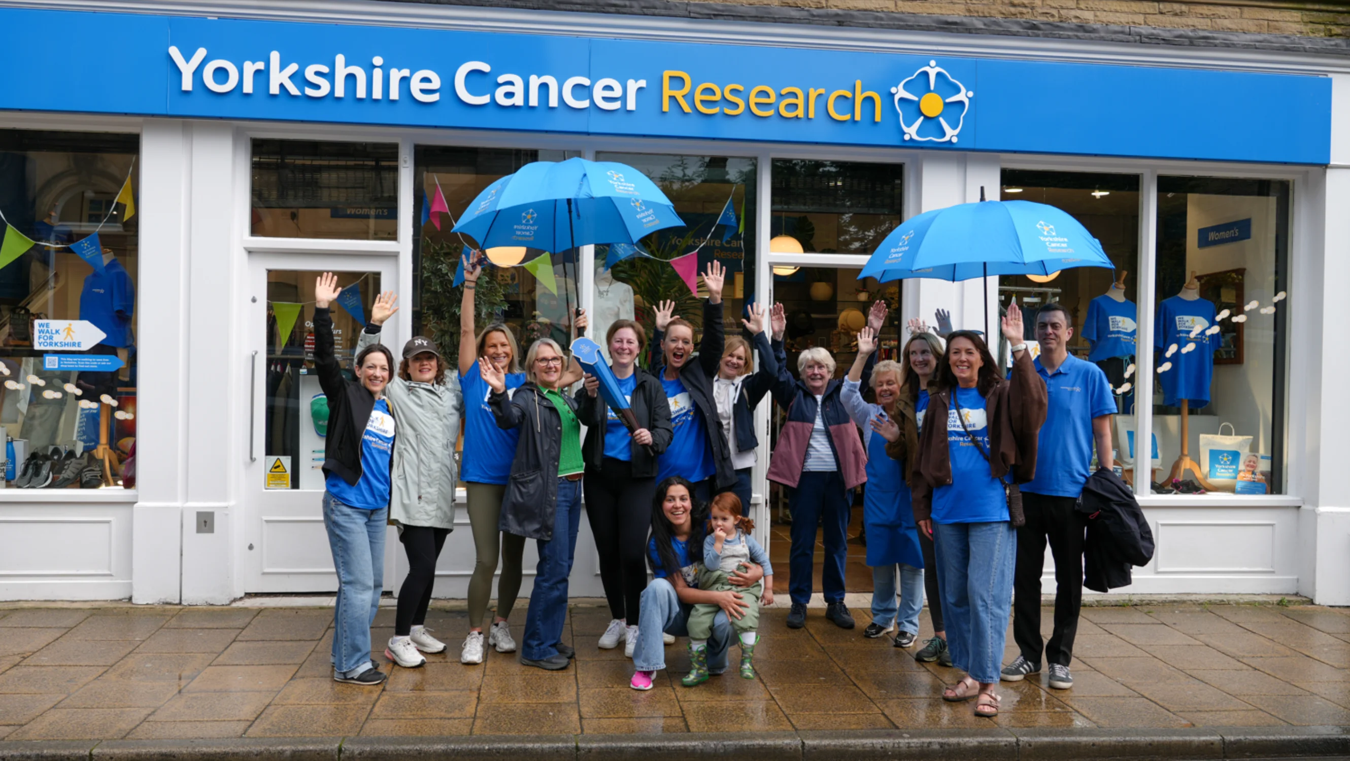 The baton bearers outside of the Harrogate shop